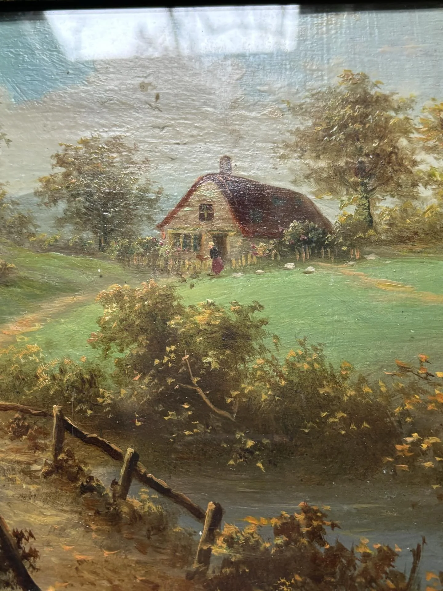 FOR SALE A delightful little late 19th century oil painting, signed. What a charming pastoral scene this is: the thatched cottage with paling fence, the chickens being fed and a rustic bridge over the brook in the foreground. Framed in a modern frame