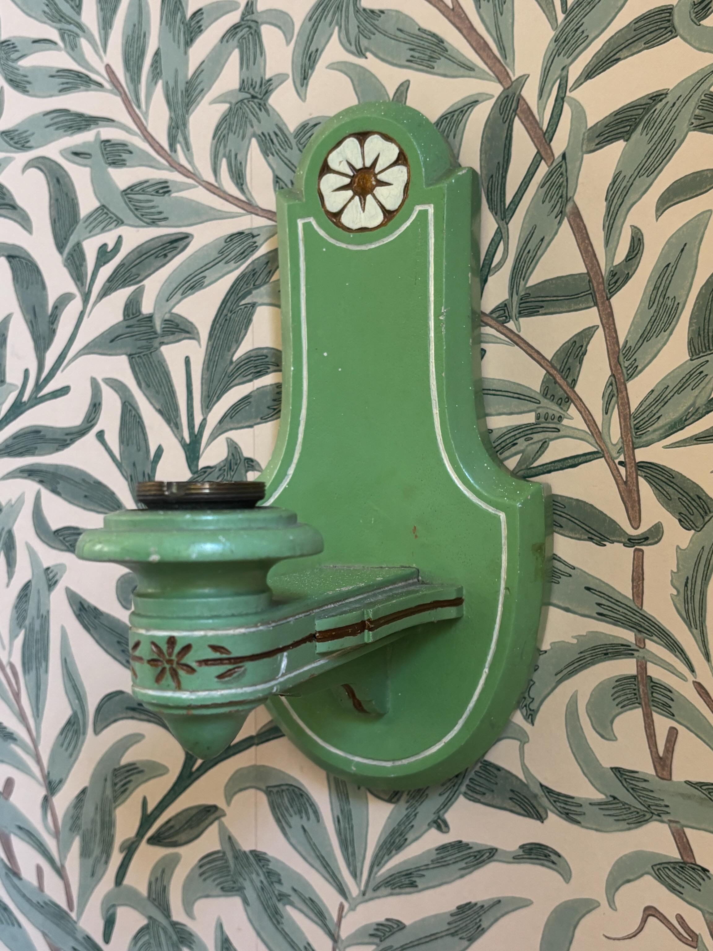 FOR SALE A French folk art vintage wooden wall sconce in a lovely pea green with cream and gold detailing. Hand carved floral motif and borders. 

It would make such a pretty candle sconce or could be wired for use as an electric wall light.

It is i