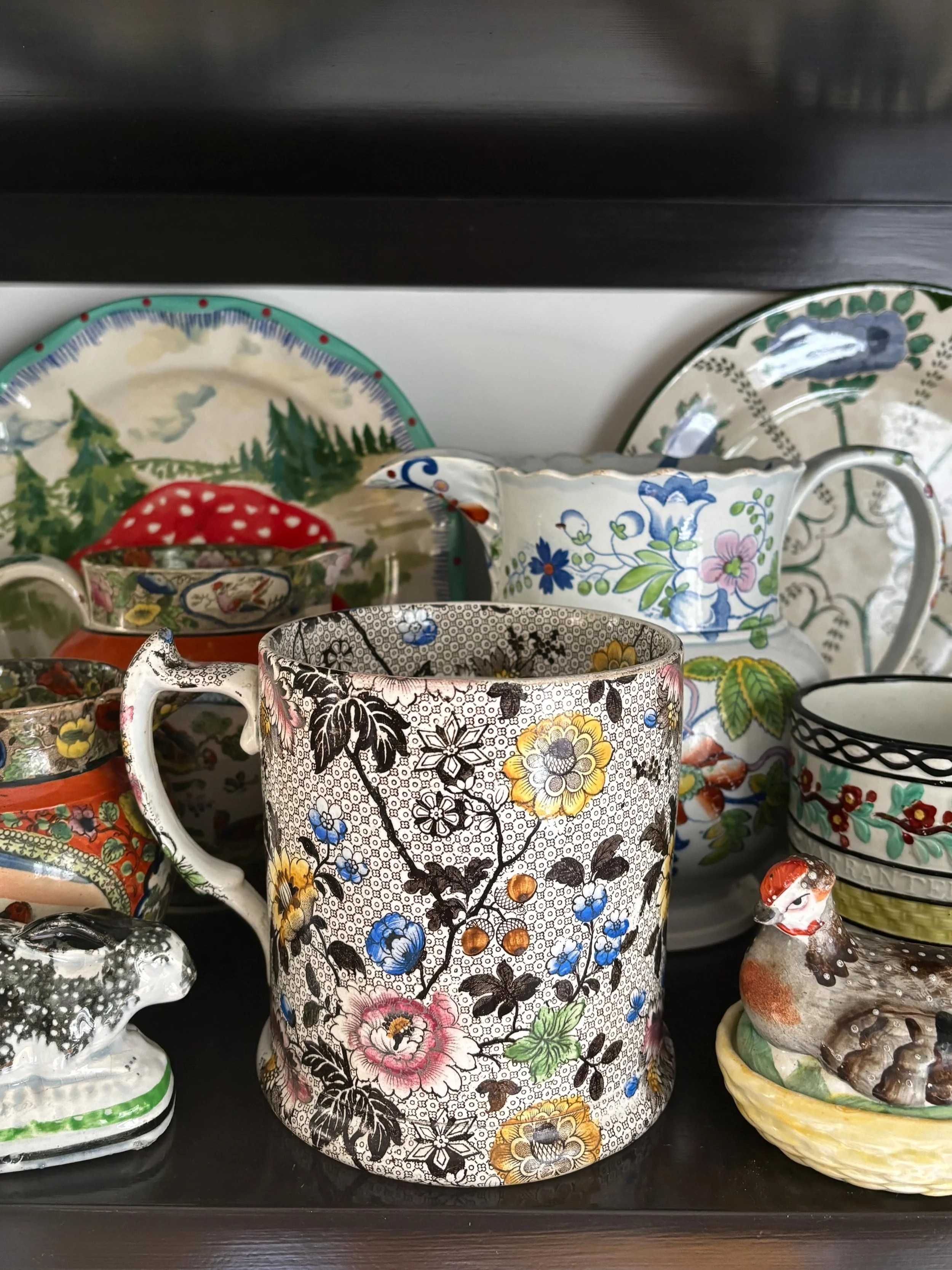 FOR SALE A magnificent, large antique transferware mug. It has a wonderful floral decoration, transfer printed in dark brown with hand colouring in dark pink, yellow, brown, green and blue. The flowers are interspersed with acorns and oak leaves alon
