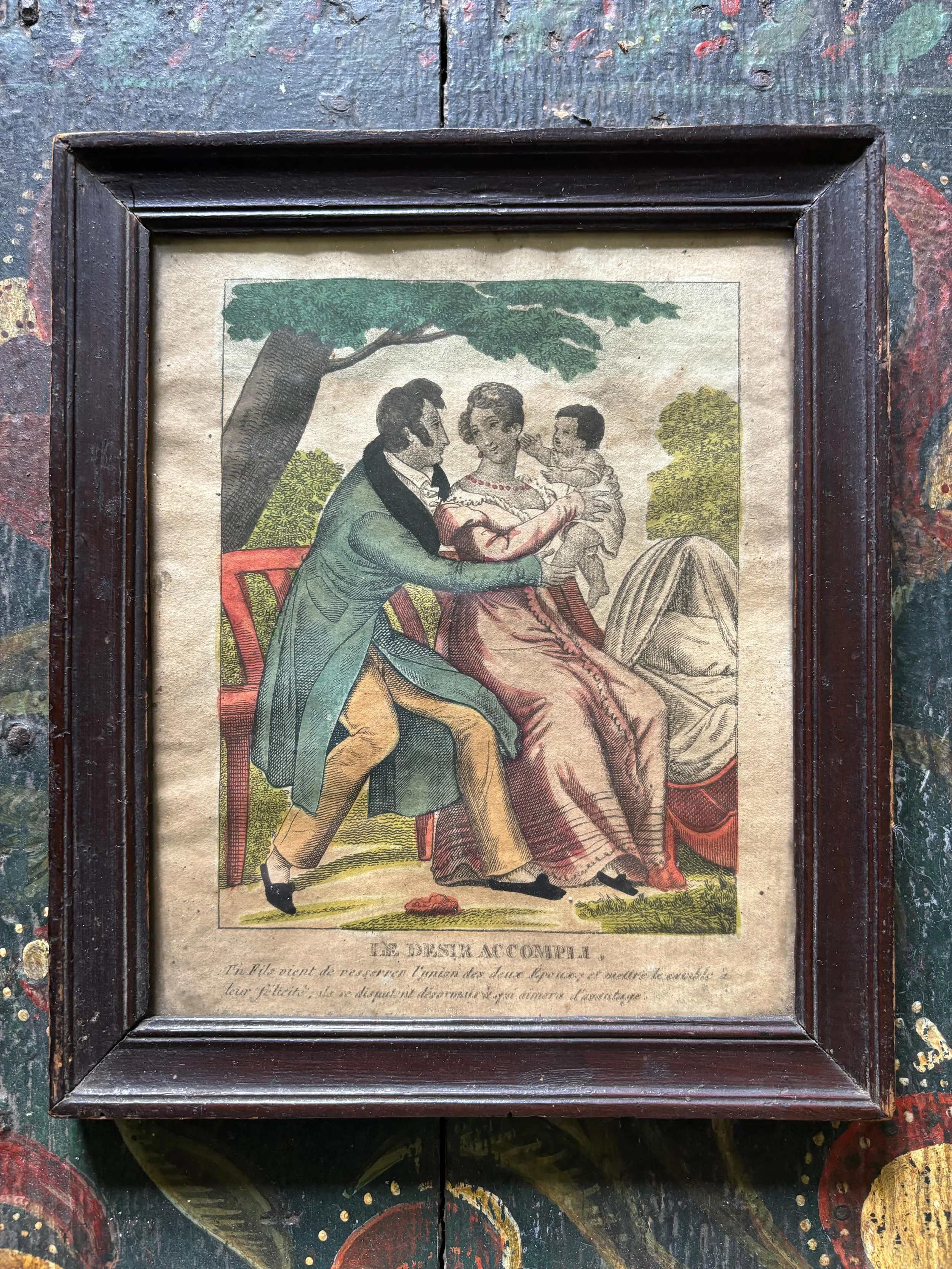 SOLD 🌟 The most charming, romantic antique hand coloured engraving entitled &lsquo;Le Desir Accompli&rsquo; (The Wish Fulfilled) circa 1800. It is framed in a period moulded frame with antique wobbly glass. 

There is a hand written list on the reve