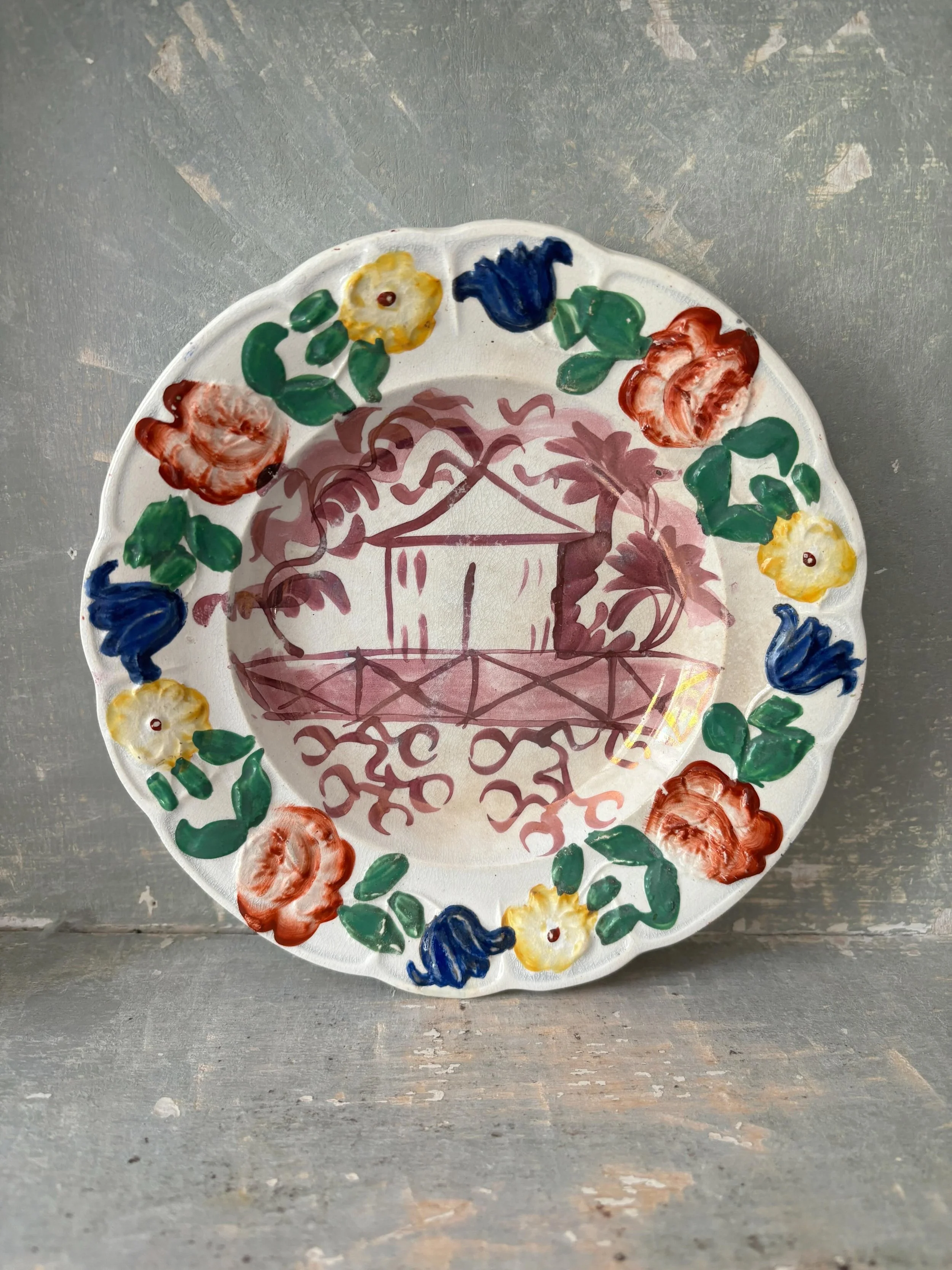 FOR SALE A wonderful collector&rsquo;s item, this is a 19th century child&rsquo;s pearlware plate made by the Cambrian Pottery in Swansea, circa 1835. It was part of the A &amp; G Tanner Collection and is a rare piece indeed. 

The central pink lustr