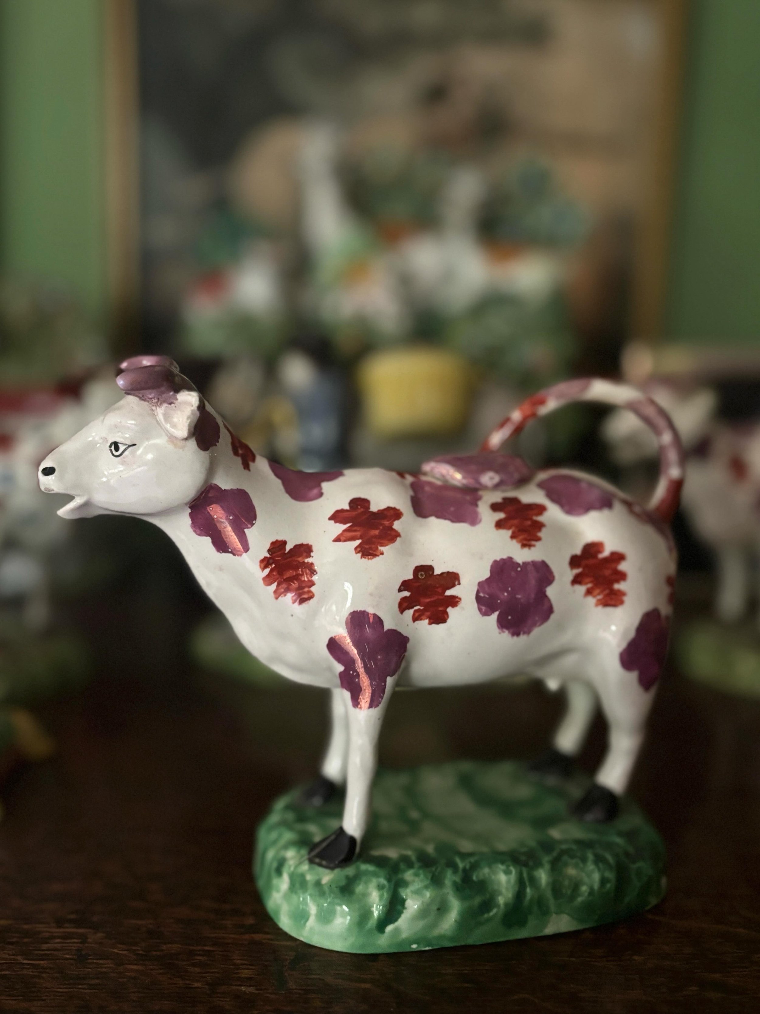 FOR SALE A scarce antique Swansea pottery cow creamer, circa 1830. It is hand painted with fabulous pink lustre decoration and was made at the Cambrian Pottery in Swansea. I am just a little obsessed with antique Staffordshire and Welsh pottery cow c