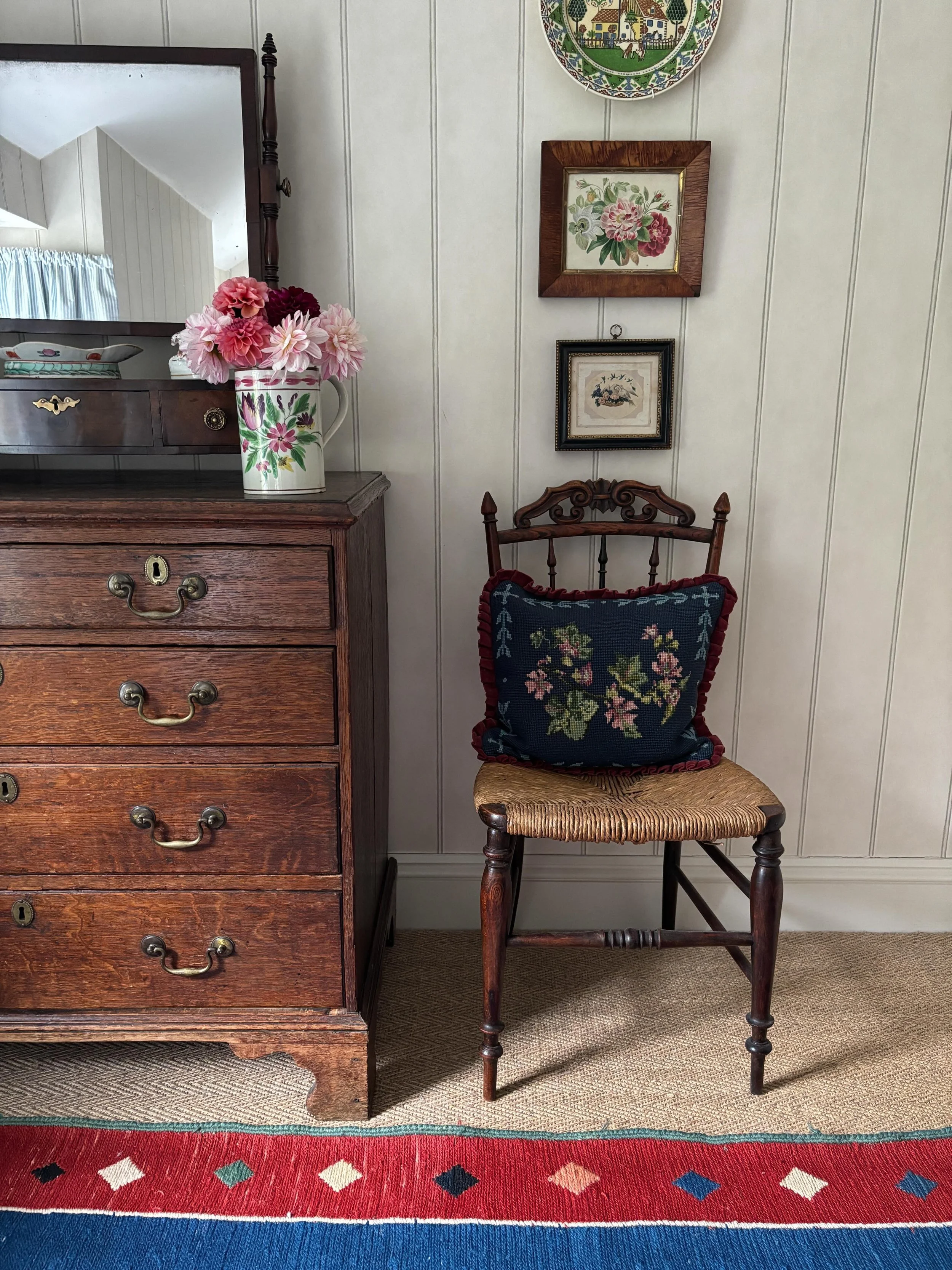 SOLD 🌟 The most charming little antique bedroom chair with hand woven rush seat. It is such a pretty piece of furniture with a rather refined look as it has beautiful slender spindles and an unusual carved decorative back. 

It is in good, robust co