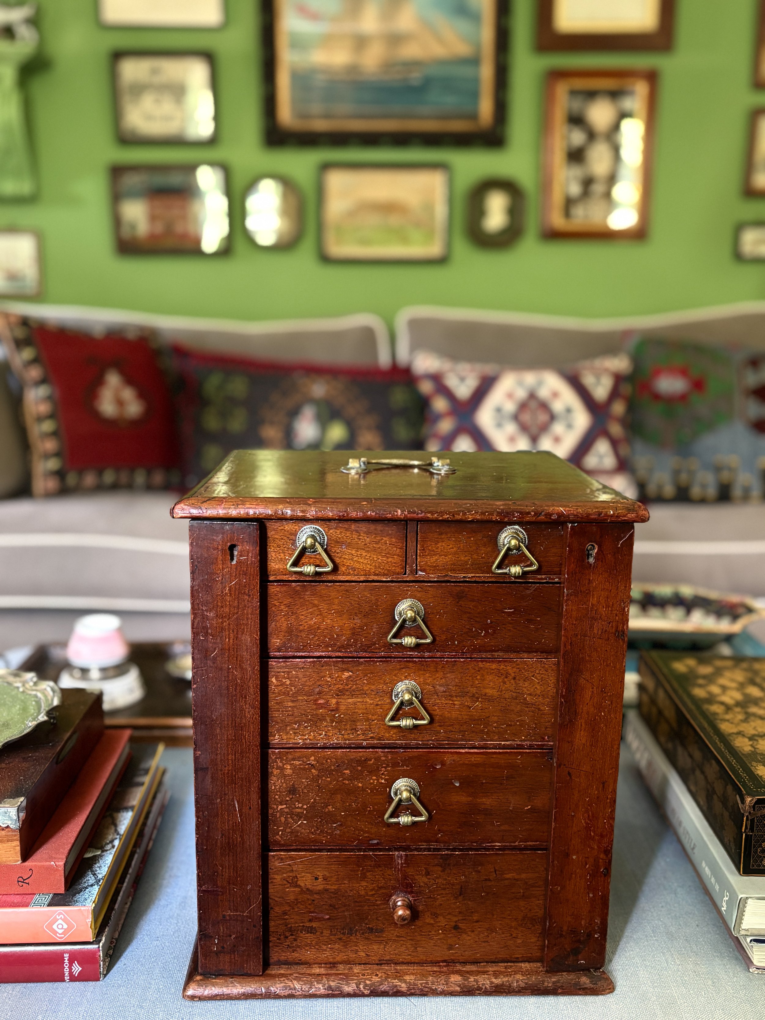 An antique collector's cabinet with brass handles