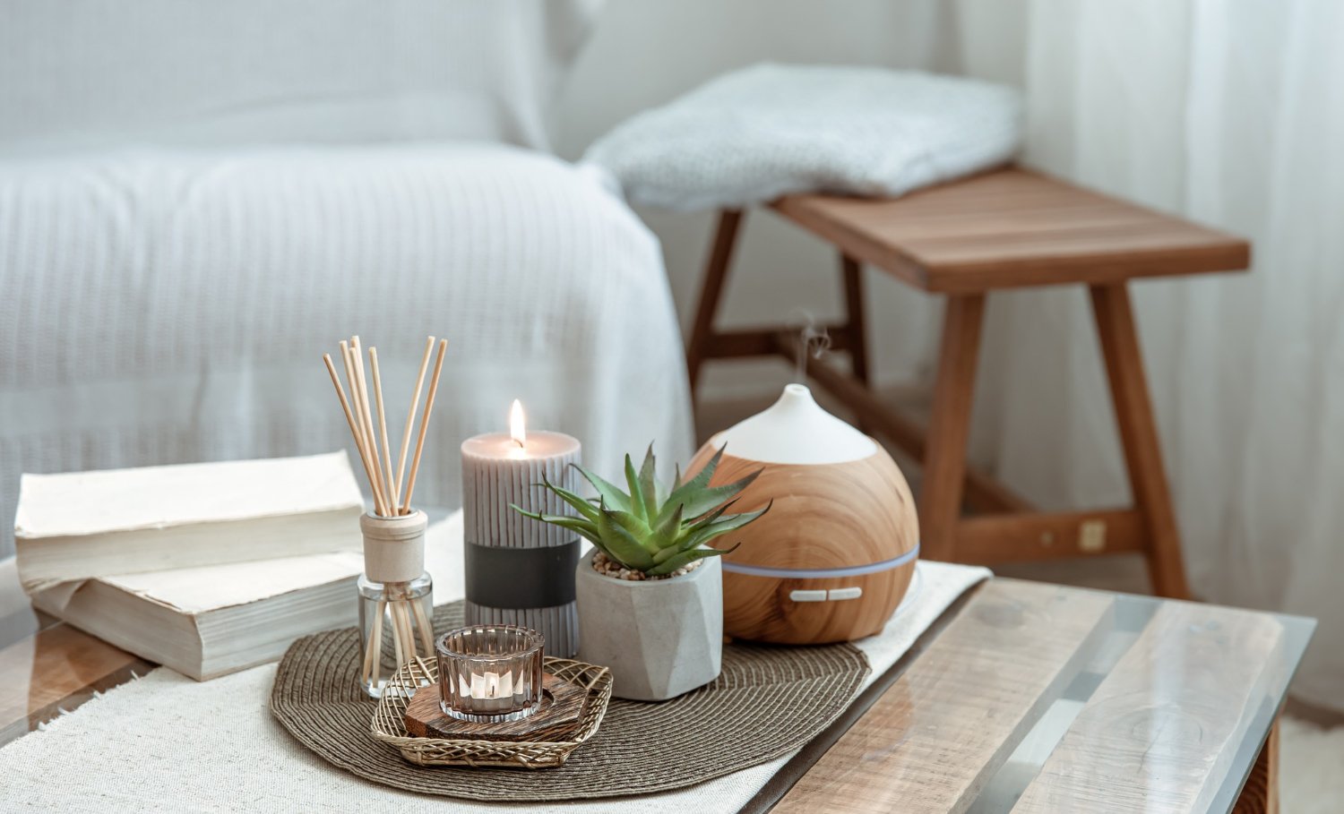 composition-with-incense-sticks-diffuser-candles-books-table-interior-room.jpg