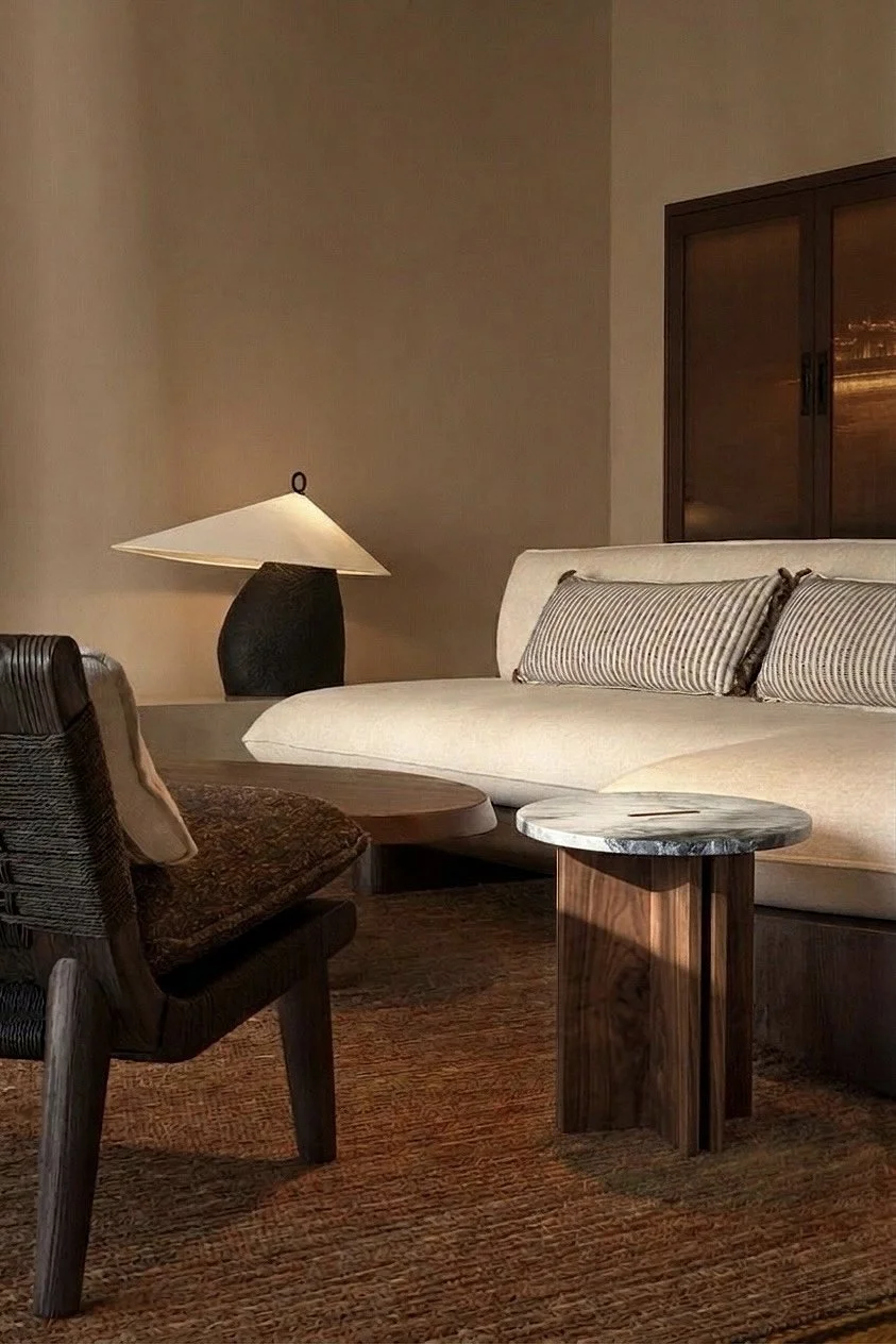 walnut side table against white sofa.jpeg