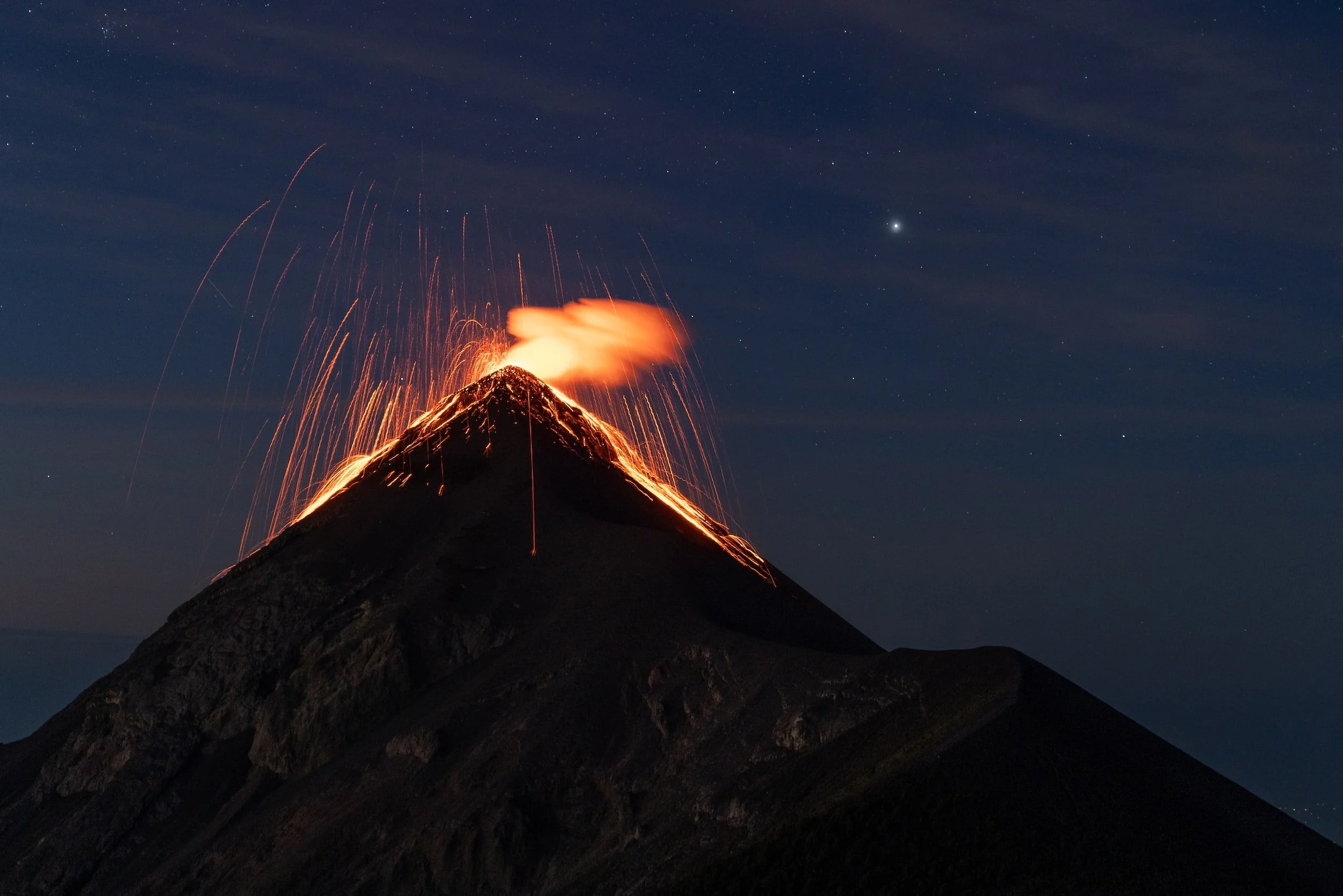 Peak of a volcano at night