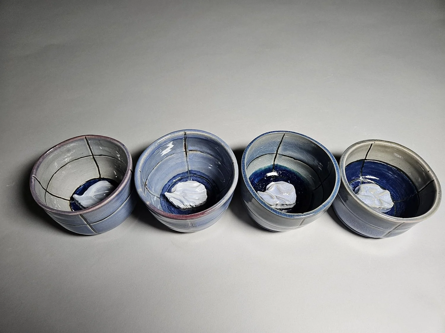 Cori Matyas, "Sea Level Rise Antarctica", stoneware and heat lamp, 2025