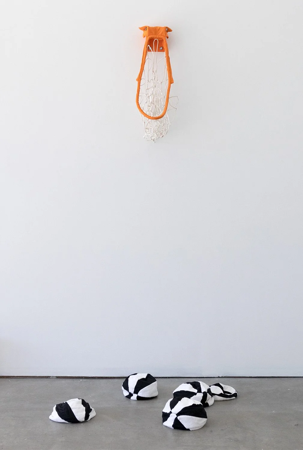 Jessica Lambert, "Sweating Bucket," spandex, basketball net, towels, bolts, 2022