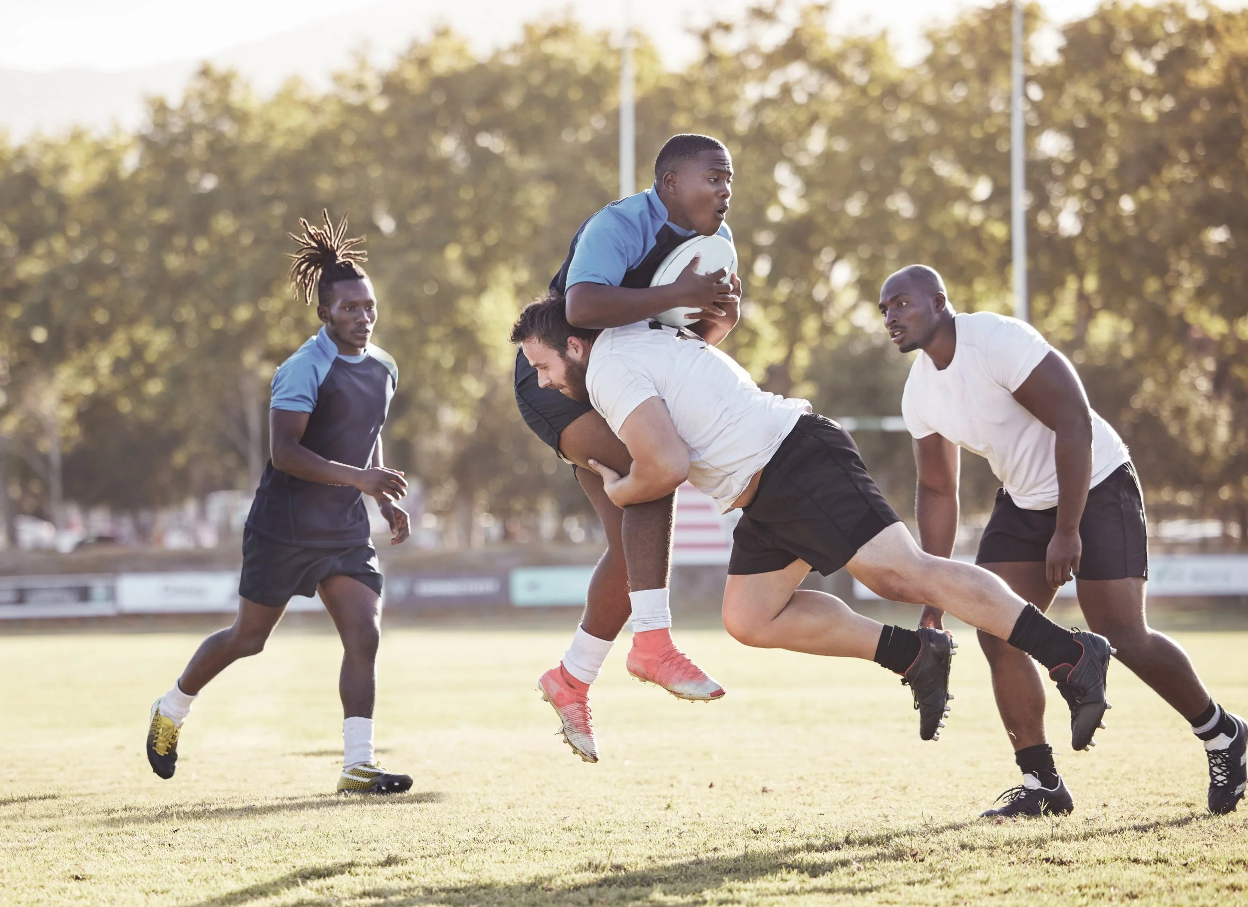 caucasian-rugby-player-attempting-to-tackle-an-opp-2023-11-27-05-06-42-utc.jpg