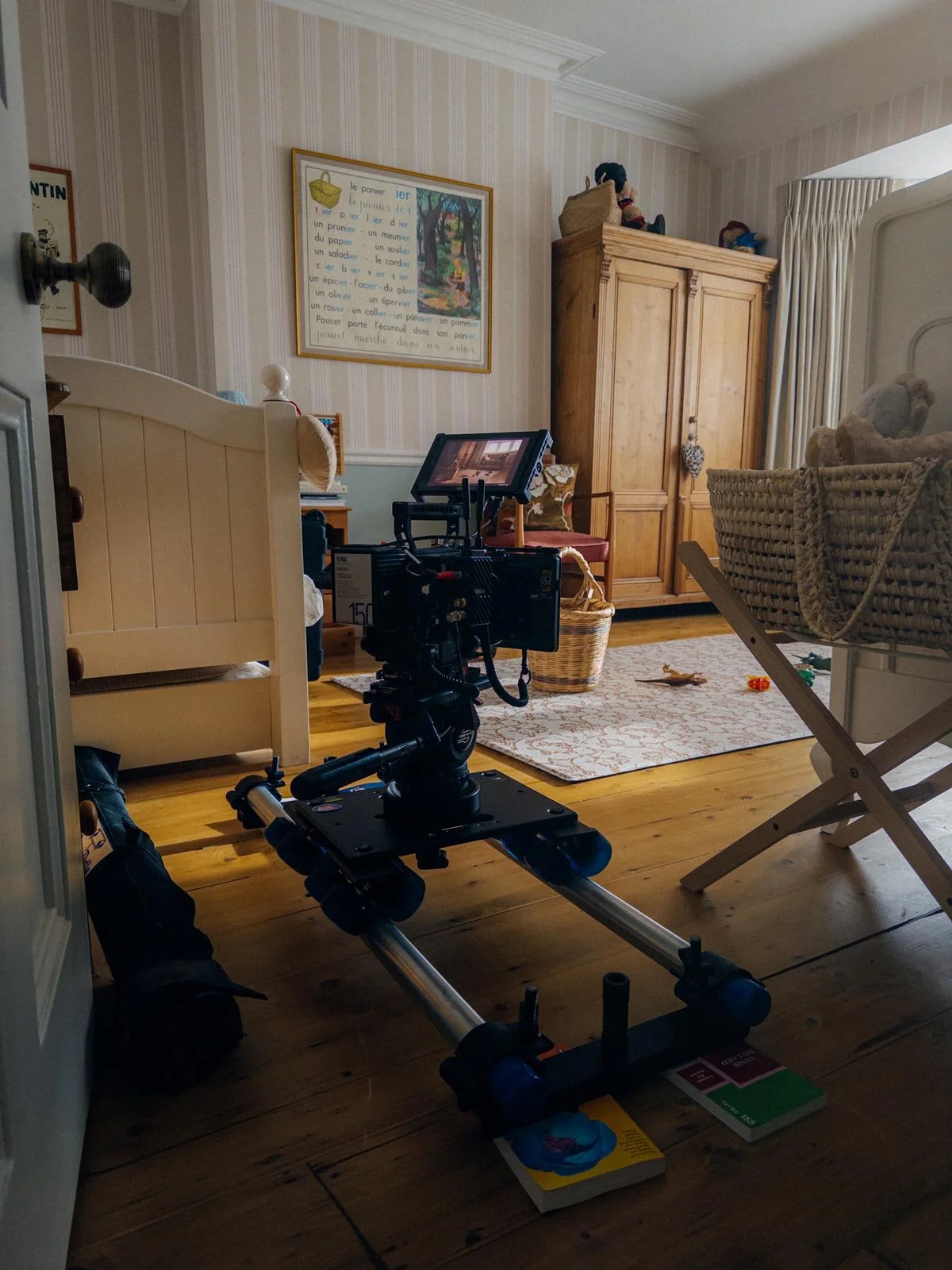 Behind-the-scenes photograph showing a cinema camera on a dolly track, taken during the filming of the video production 'Affected Others' for GambleAware, produced by production company Rob Pinney Studio.