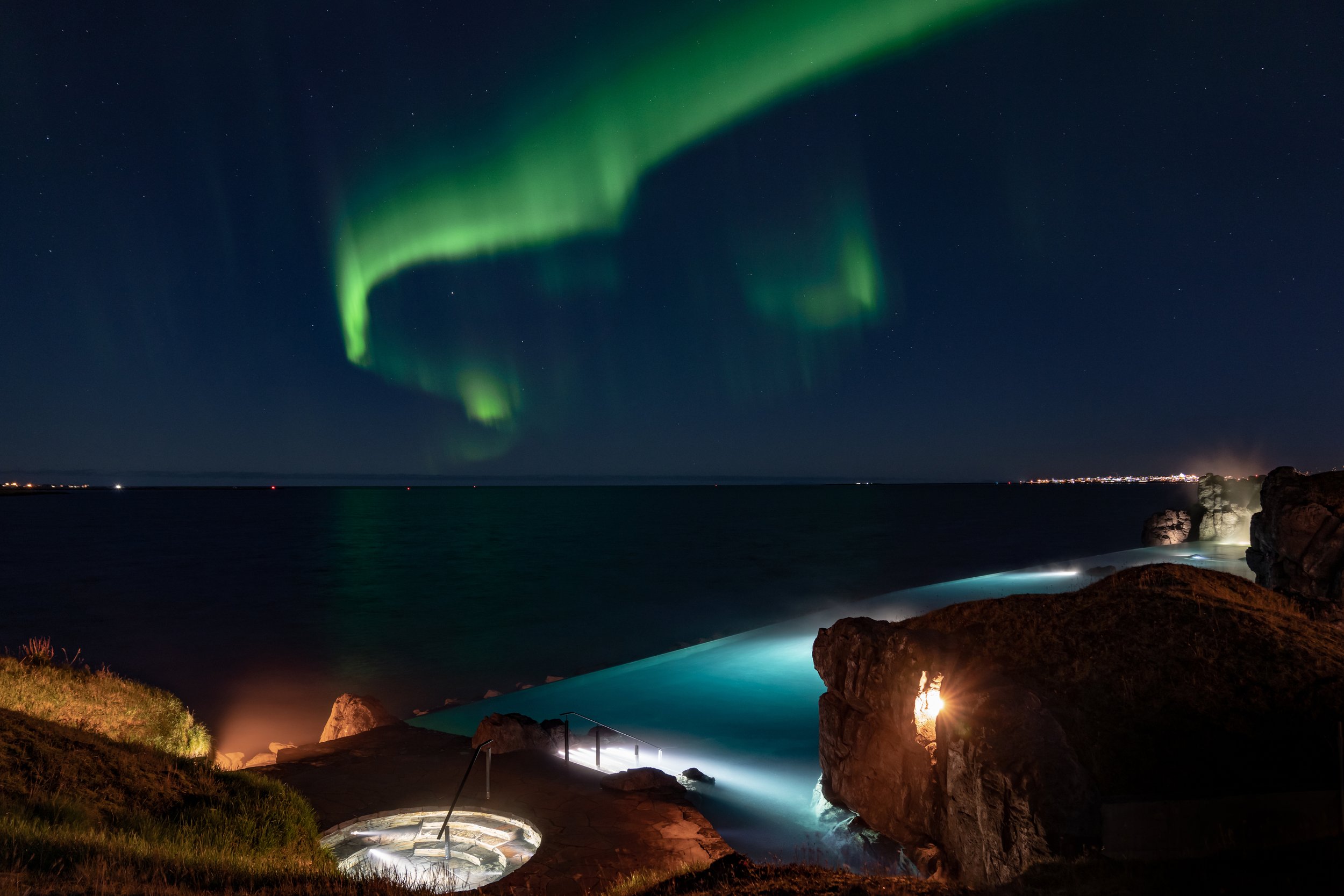 Sky Lagoon Hot Spring Near Reykjavik With Northern Lights Above
