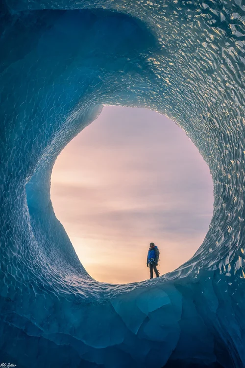 Person standing inside an ice cave in Iceland