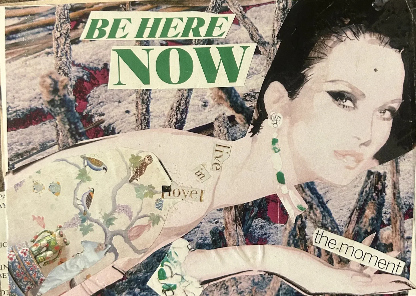 A collage artwork featuring a woman with black hair, light skin, and jewelry, with text reading 'BE HERE NOW' and 'the moment', set against a textured background with various decorative elements.