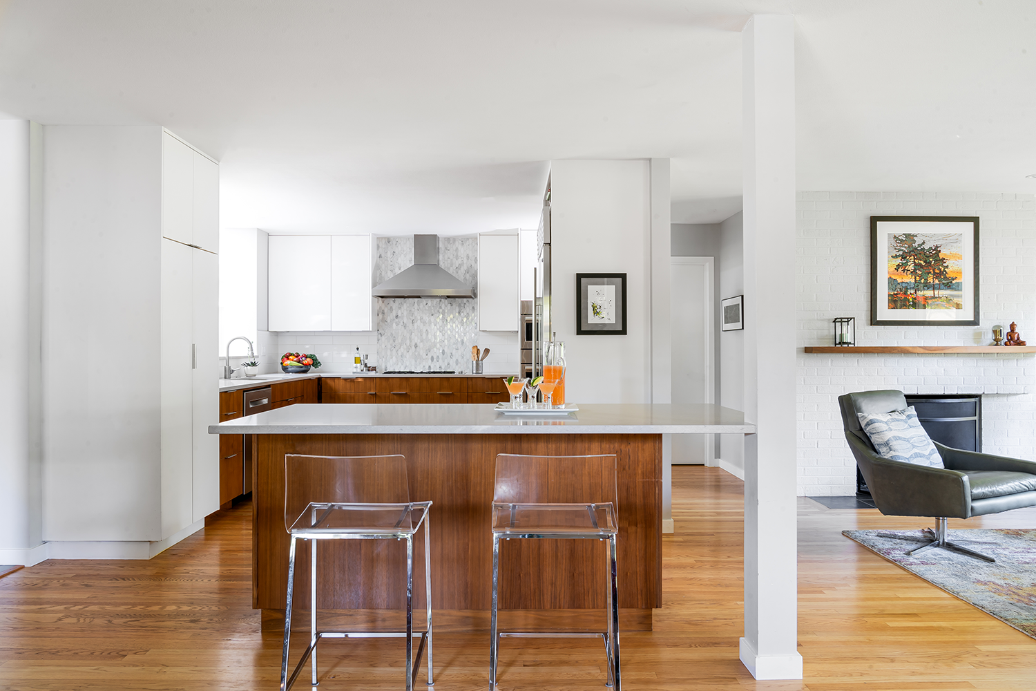 1950s Portland ranch kitchen remodel, before dated closed kitchen, after open-concept walnut-and-white kitchen, by Studio Garrison.