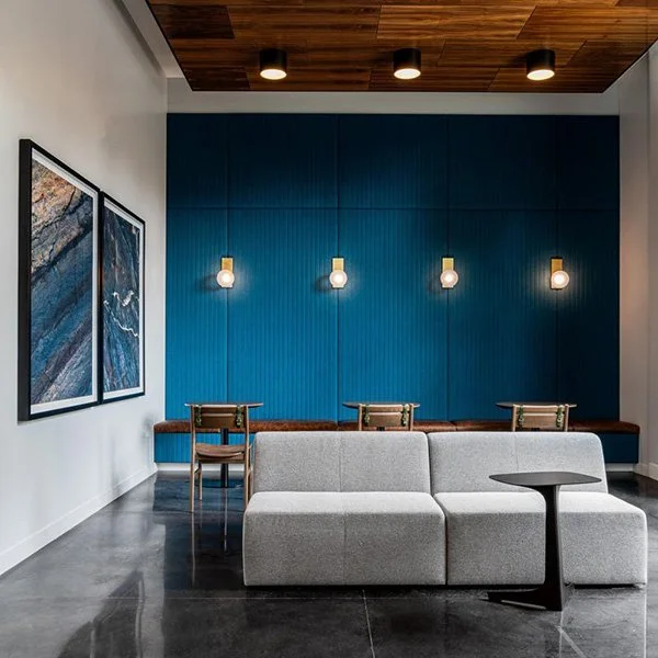 A seating area with a blue wall.