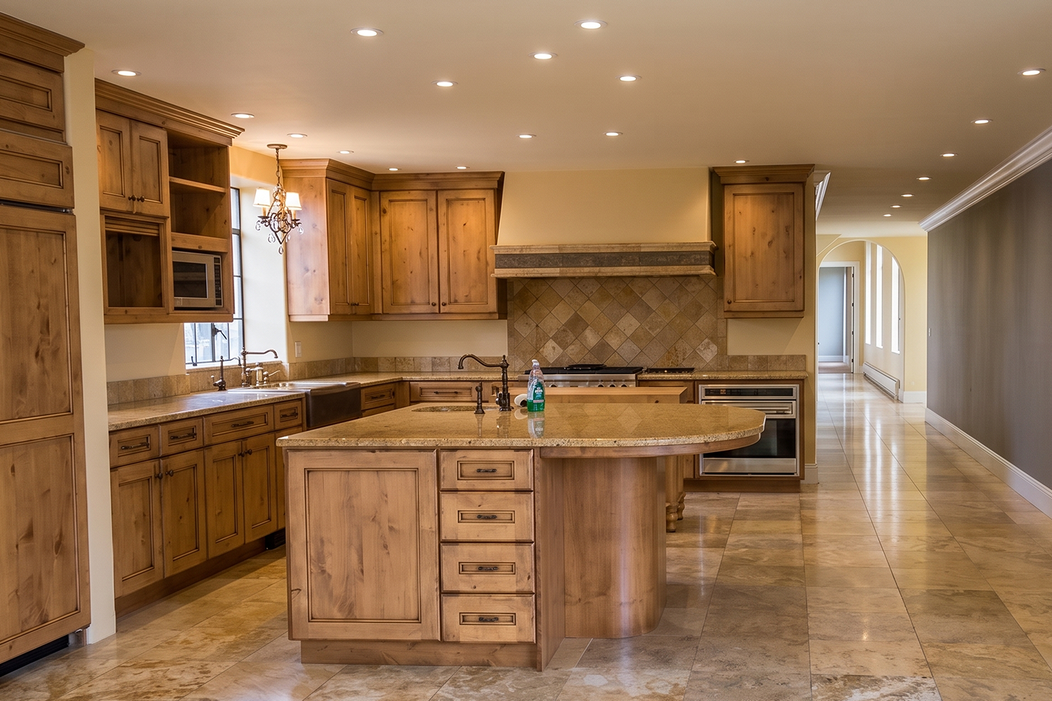 Historic Portland penthouse kitchen remodel, before dark Tuscan wood cabinets.