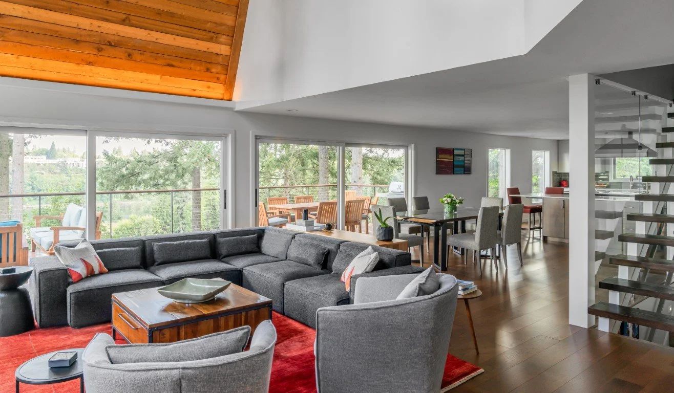 Living room with wood ceiling and upholstered furniture.