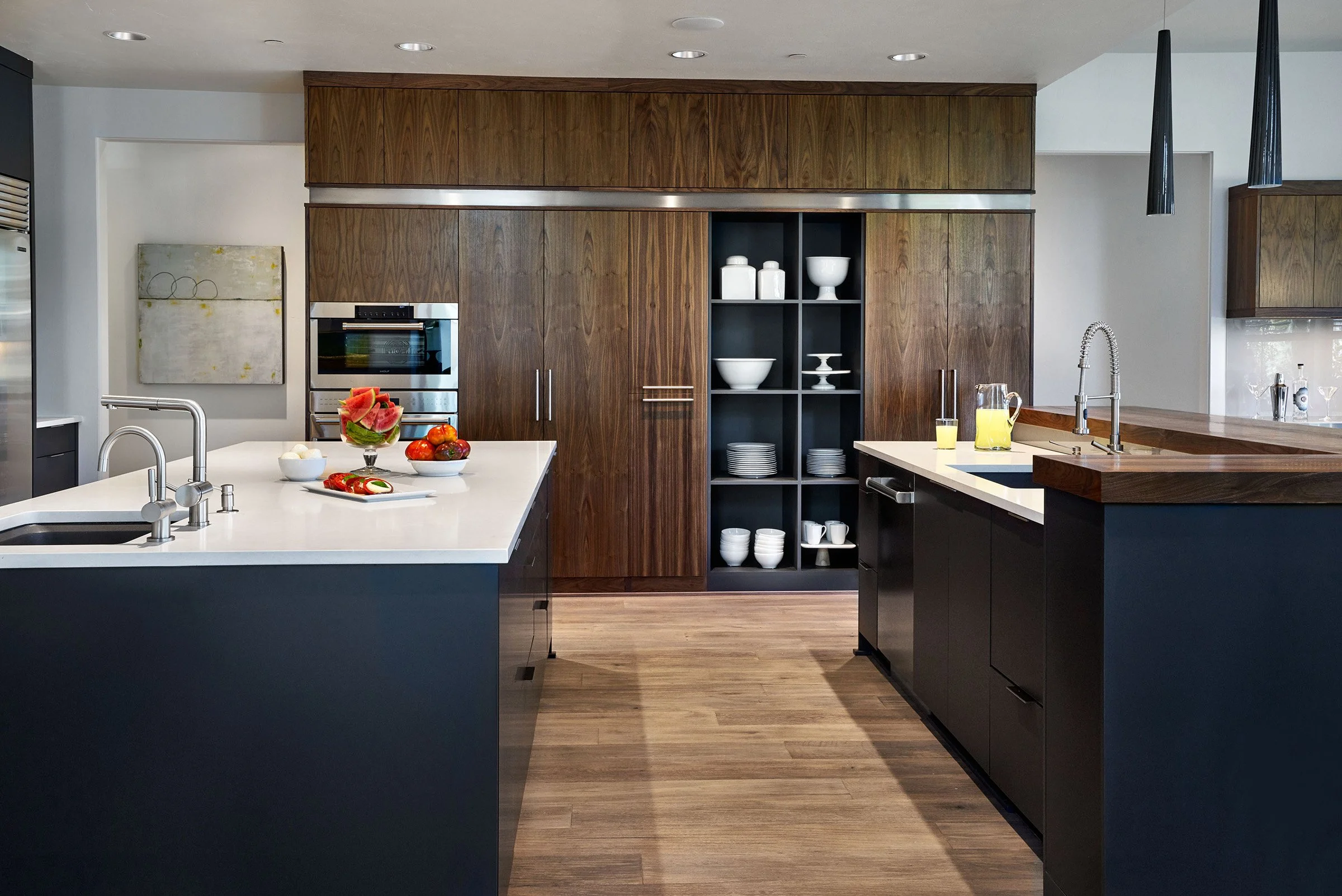 A kitchen with several unique workzones.