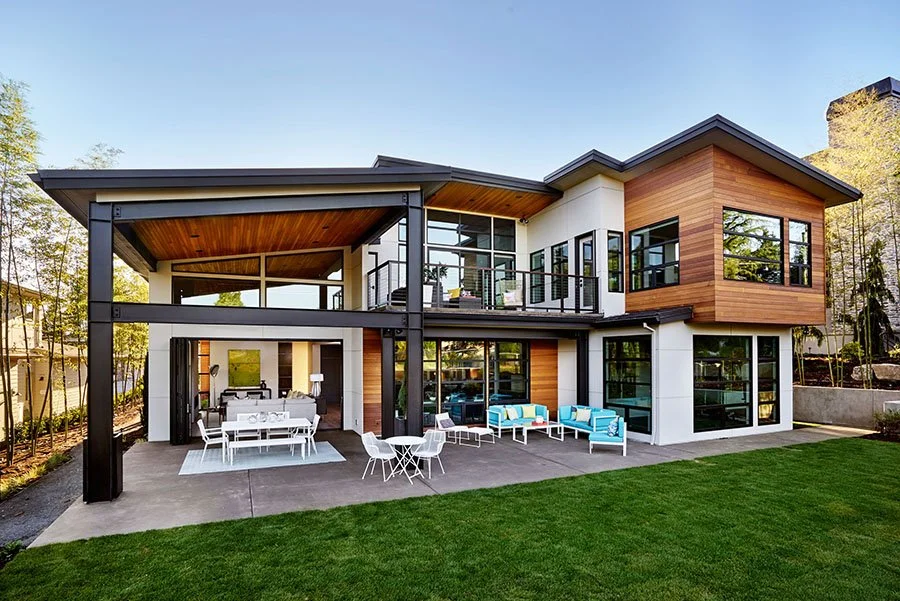 An eclectic modern home from the viewpoint of the backyard.