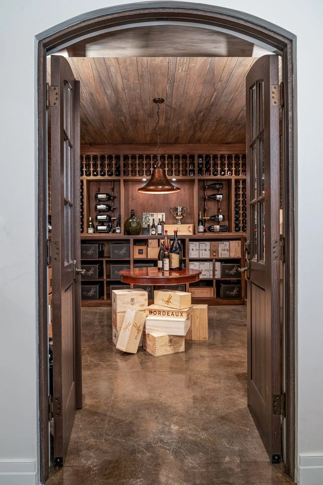 A wine storage room with custom cabinetry.