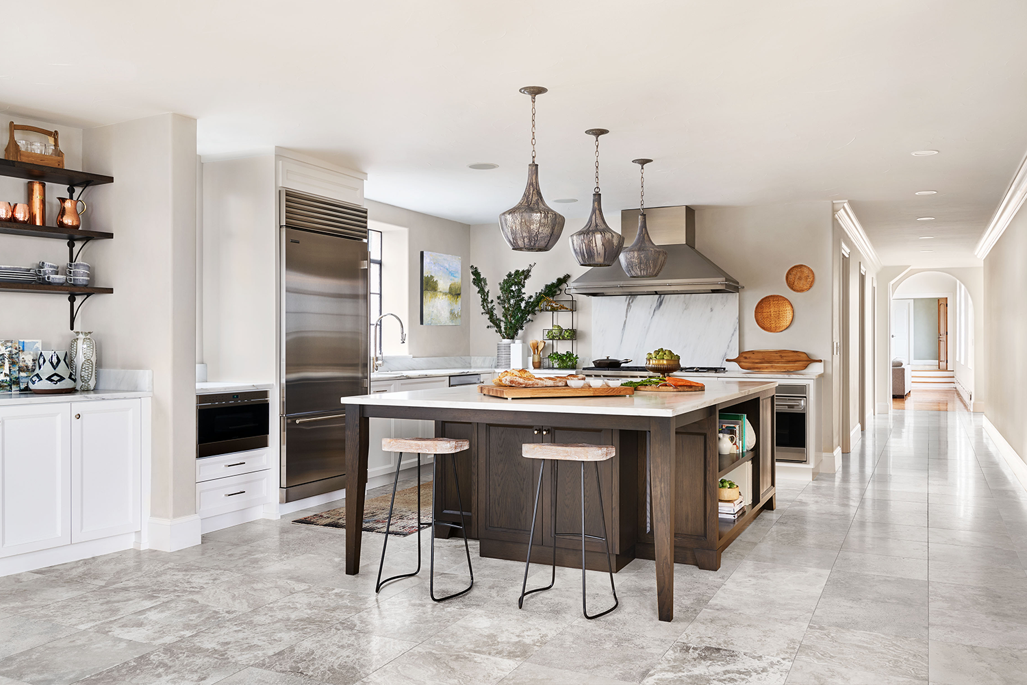Historic Portland penthouse kitchen remodel, after bright white Shaker kitchen with stone counters, by Studio Garrison.