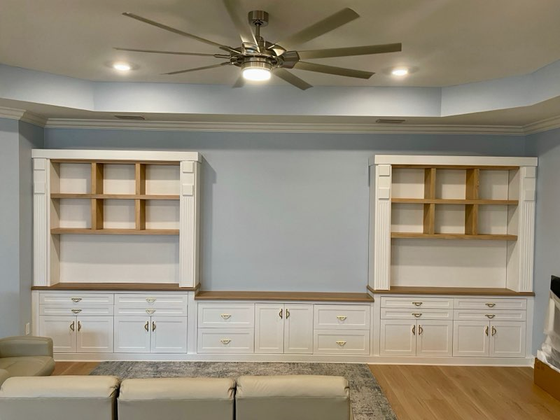 Size: 19' wide x 7' high   •  Style: Modern  •  Finish: Color Match in Satin Paint with Custom Wood Stain to match the flooring • Recessed Panel Doors • Birch Soft-close Drawers and Roll-outs