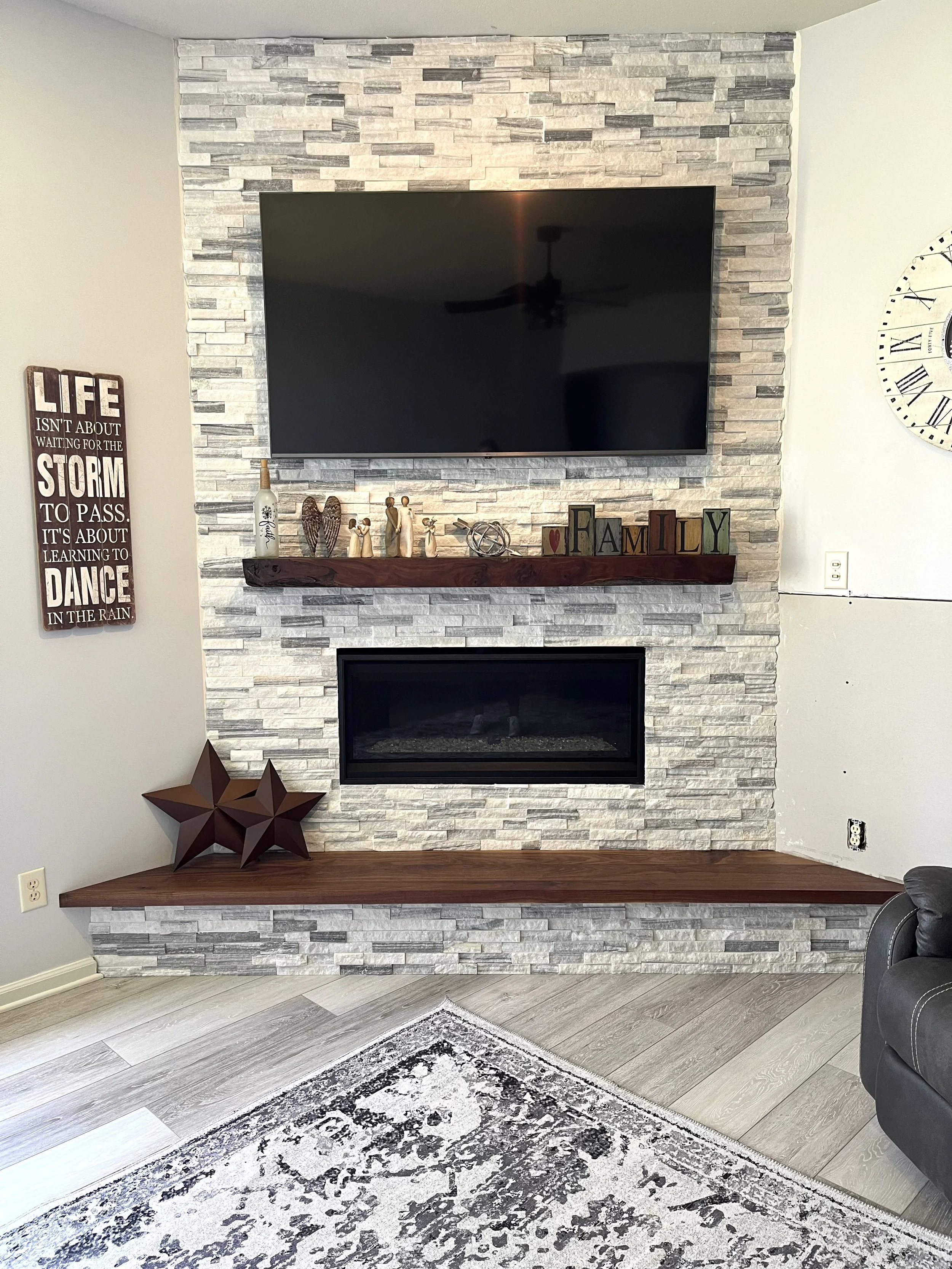 Stone fireplace with walnut accents