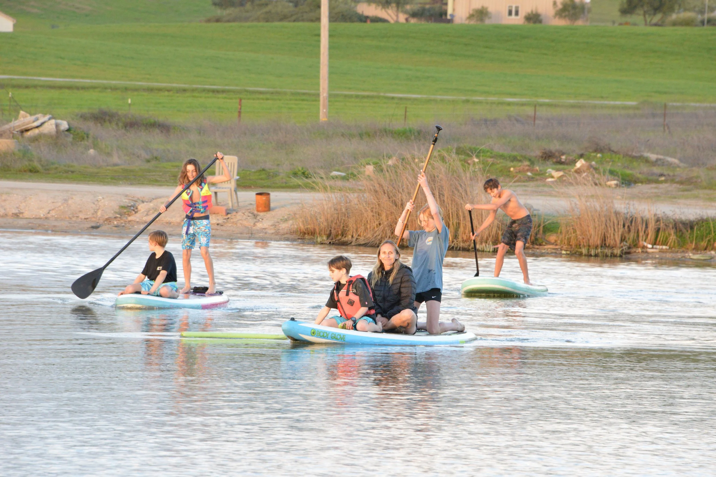 People Enjoying Paddleboarding 