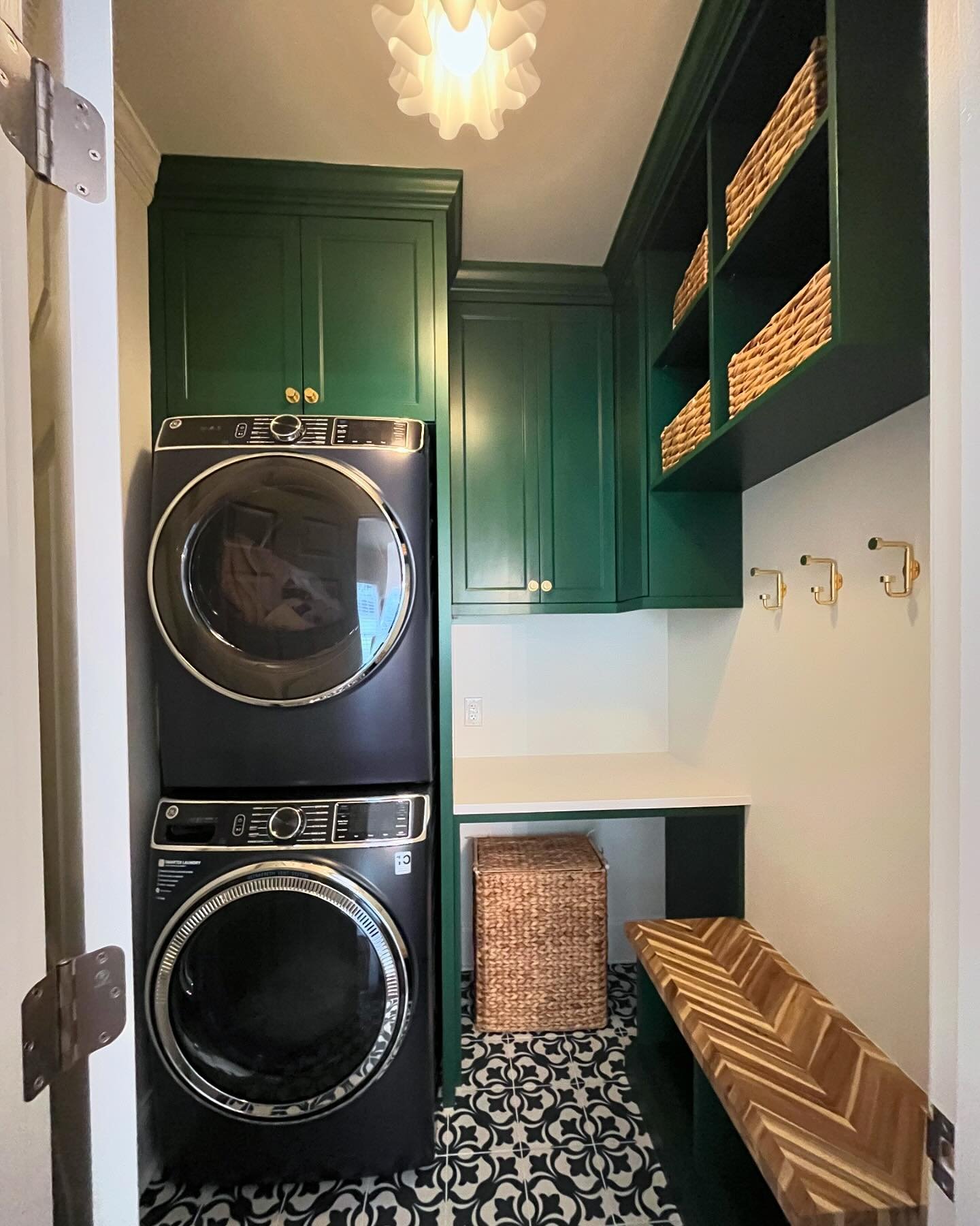 What an impact this little room makes! It was a little laundry room off of the kitchen and beside the garage door. Our client really wanted to find a way to make it multi-functional while also being beautiful! We moved the door to the opposite wall, 