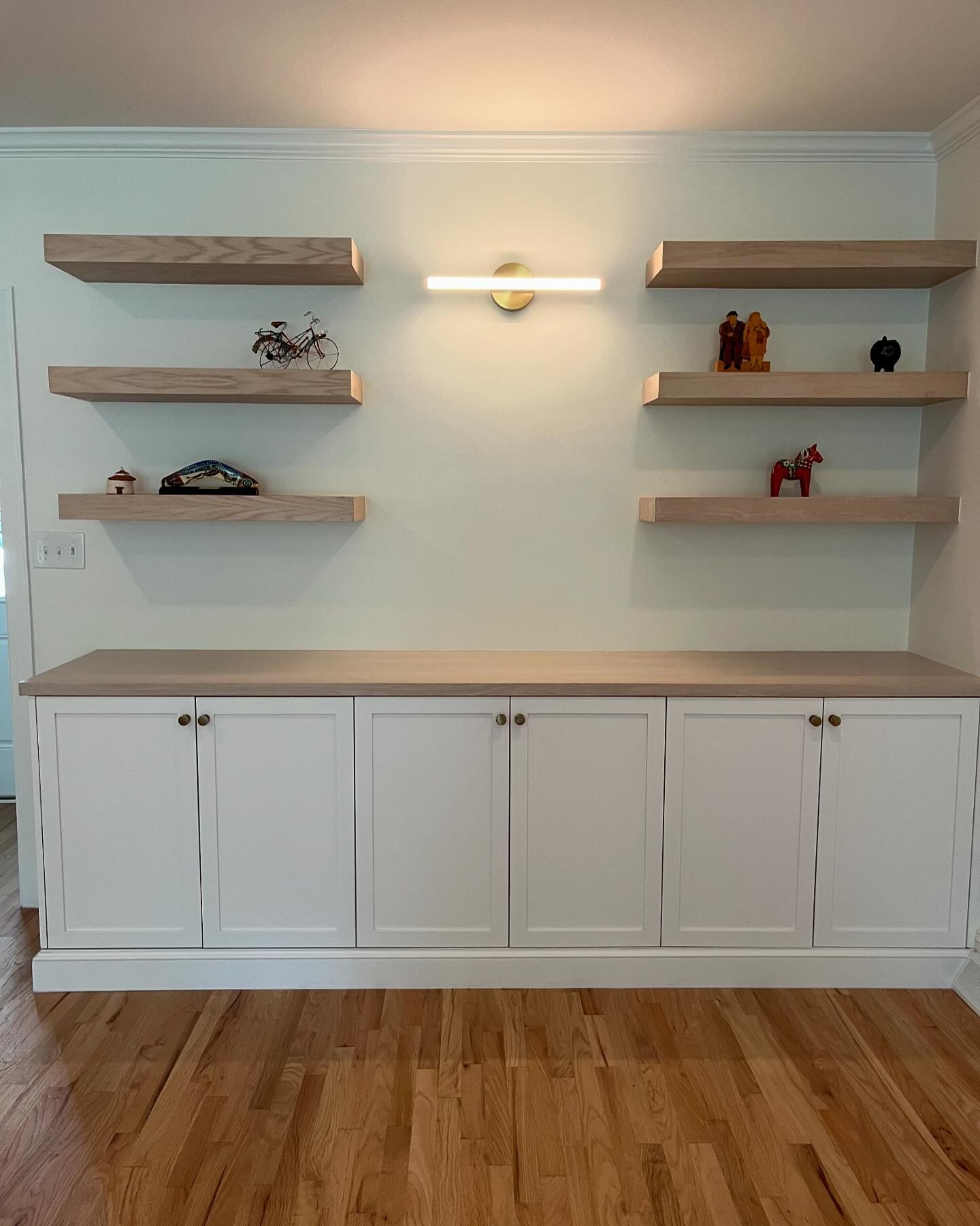 Who doesn&rsquo;t love a blank slate?! We filled this living room wall with @carolinaoakandco beautiful craftsmanship and made this space functional and pretty to look at! 

#livingroom #livingroomstorage #builtins #interiordesign #homeremodel #built