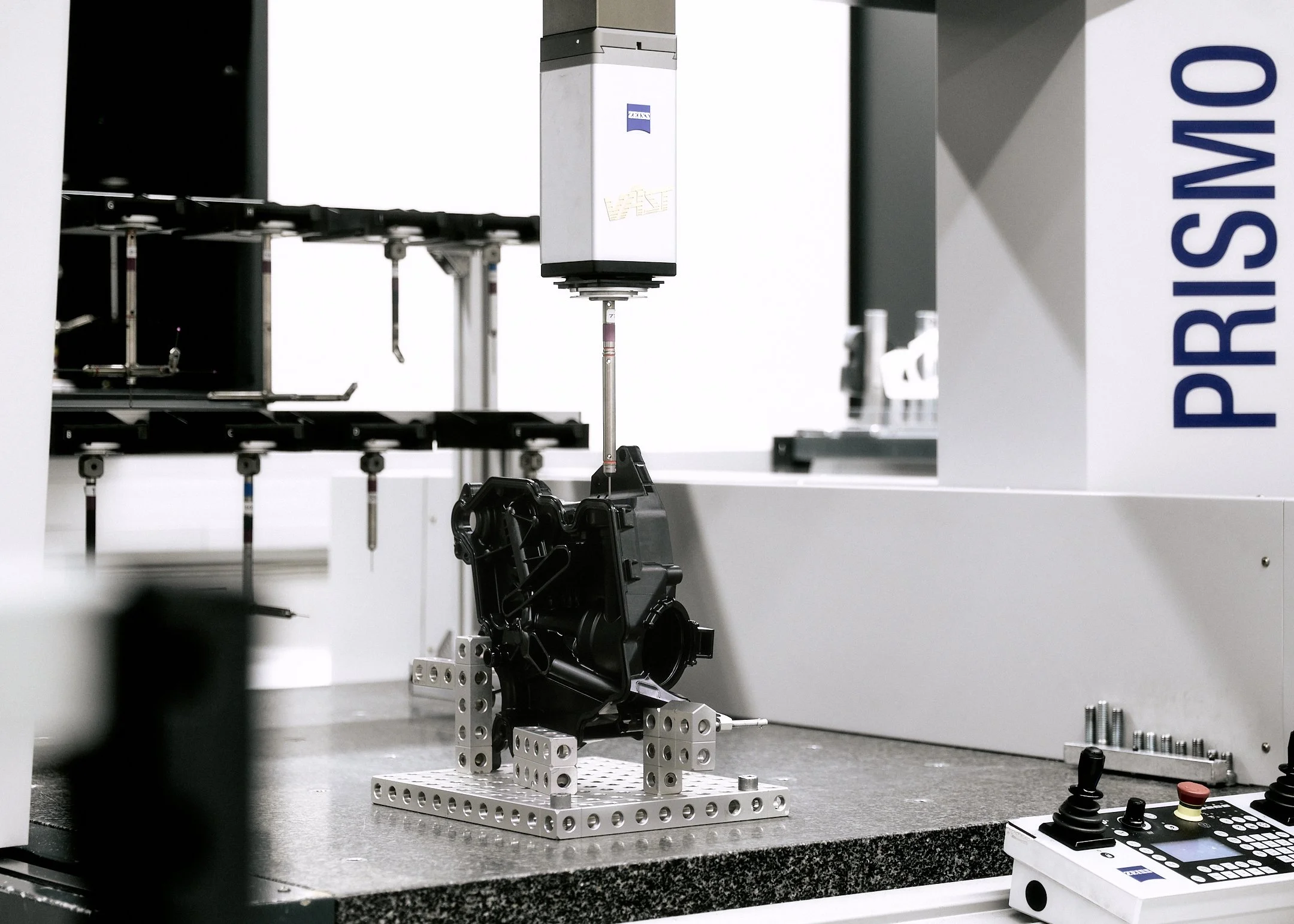 Industrial measurement machine inspecting a component on a test bench at MAHLE