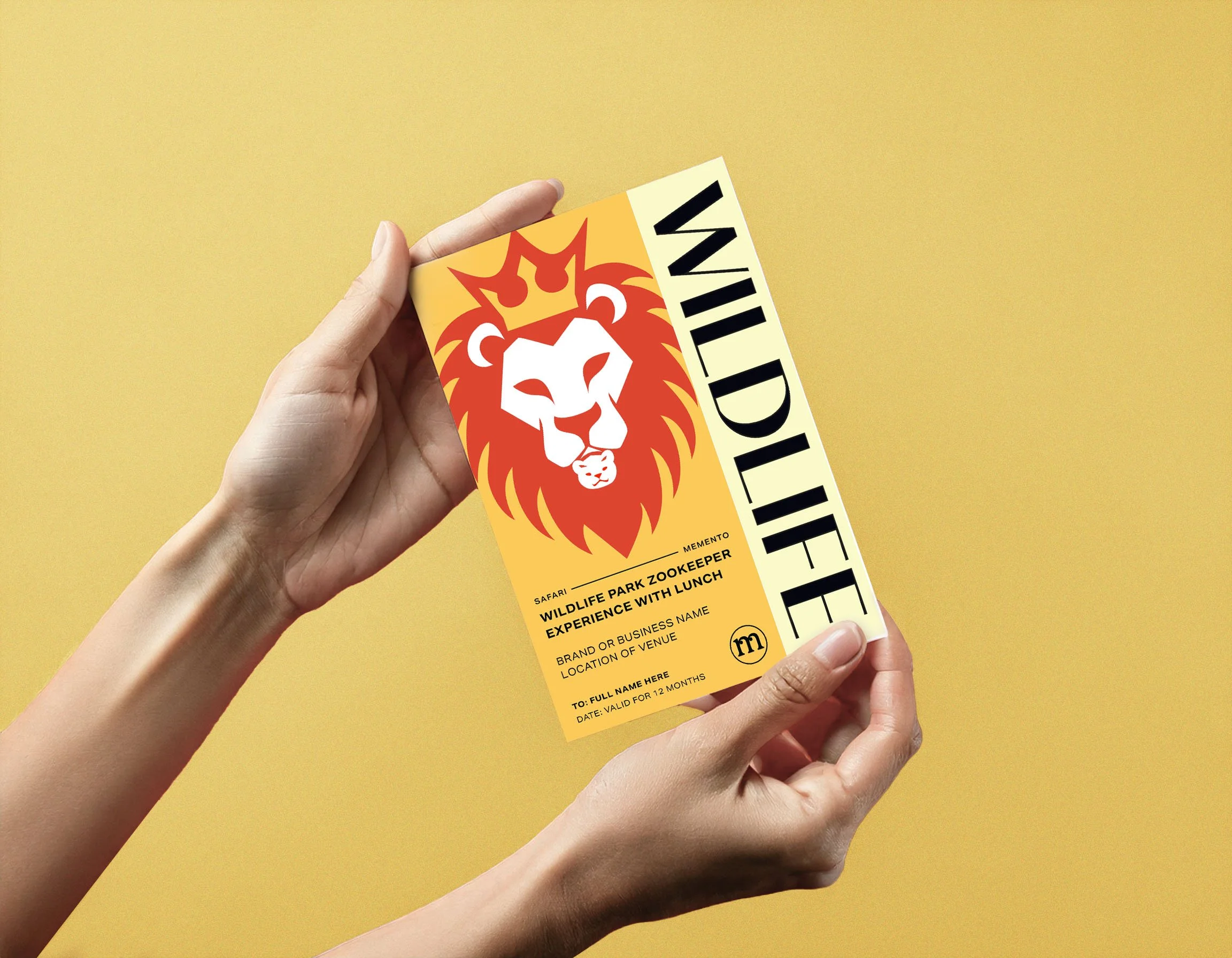 A person holding a yellow ticket with a lion's face graphic and the word 'WILDLIFE' in bold black letters, against a yellow background.