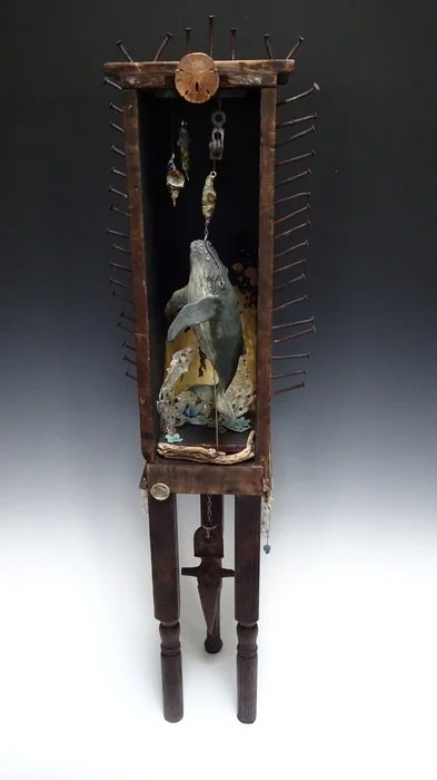 PLASTIC: A NAIL IN THE COFFIN / Artist: Lisa Bonilla Panter / 34.25" x 11" x 9" / $1,200 / Hand-Sculpted Whale Fired Out of Clay, Melted Plastic Pieces, Found Items