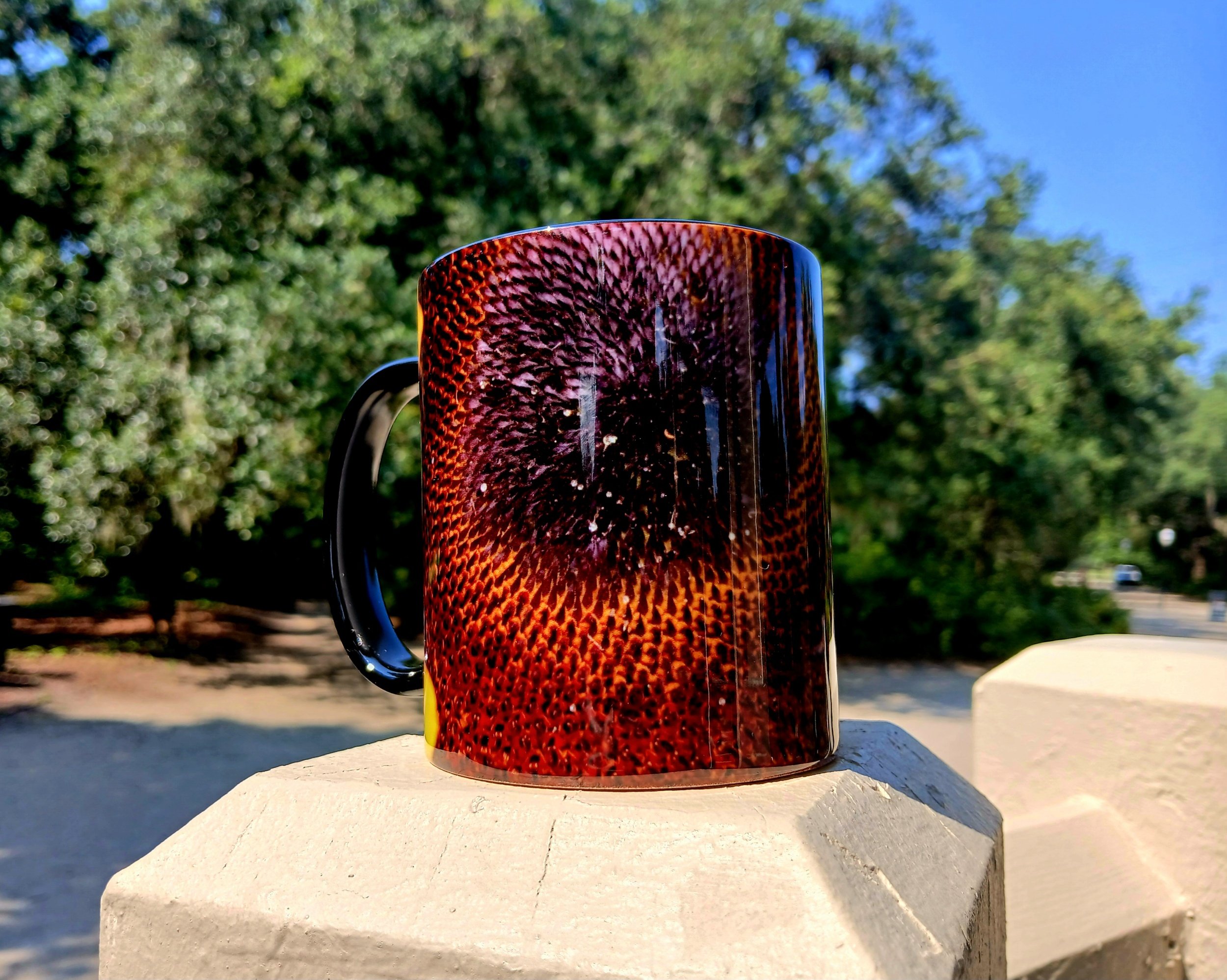 Sunflower imprinted drinking mug.