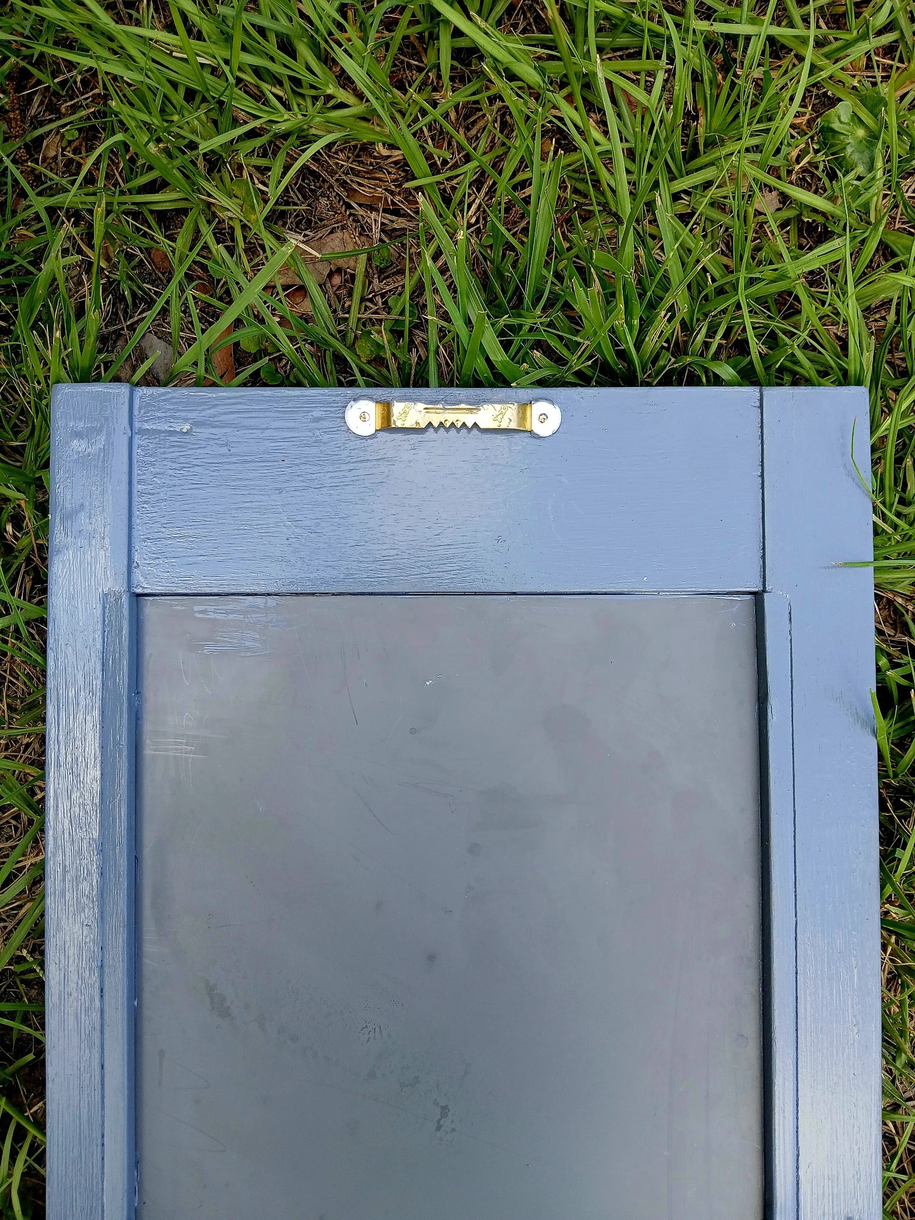 Back of mirror with sawtooth hook.