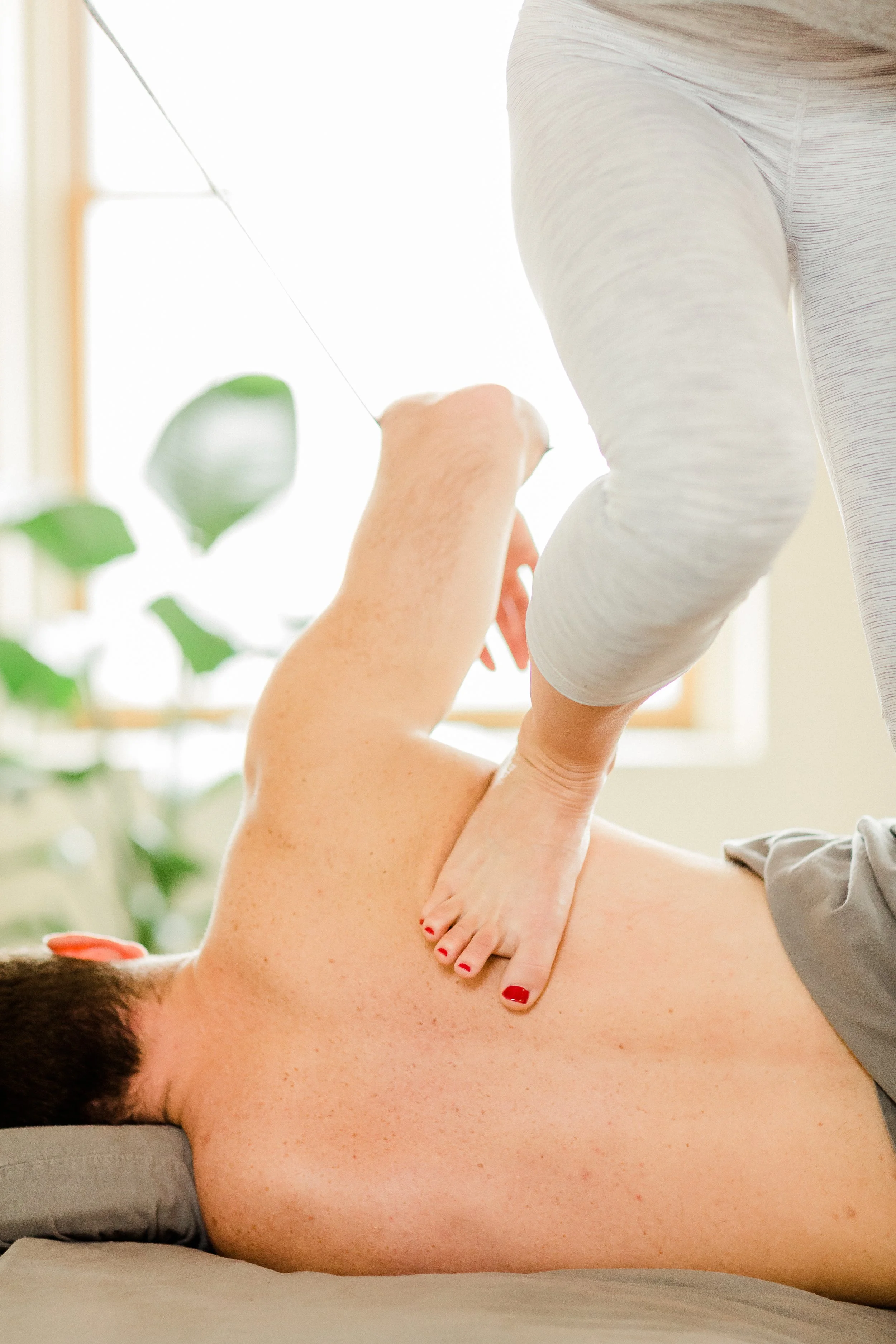 side lying close up client arm in strap.jpg