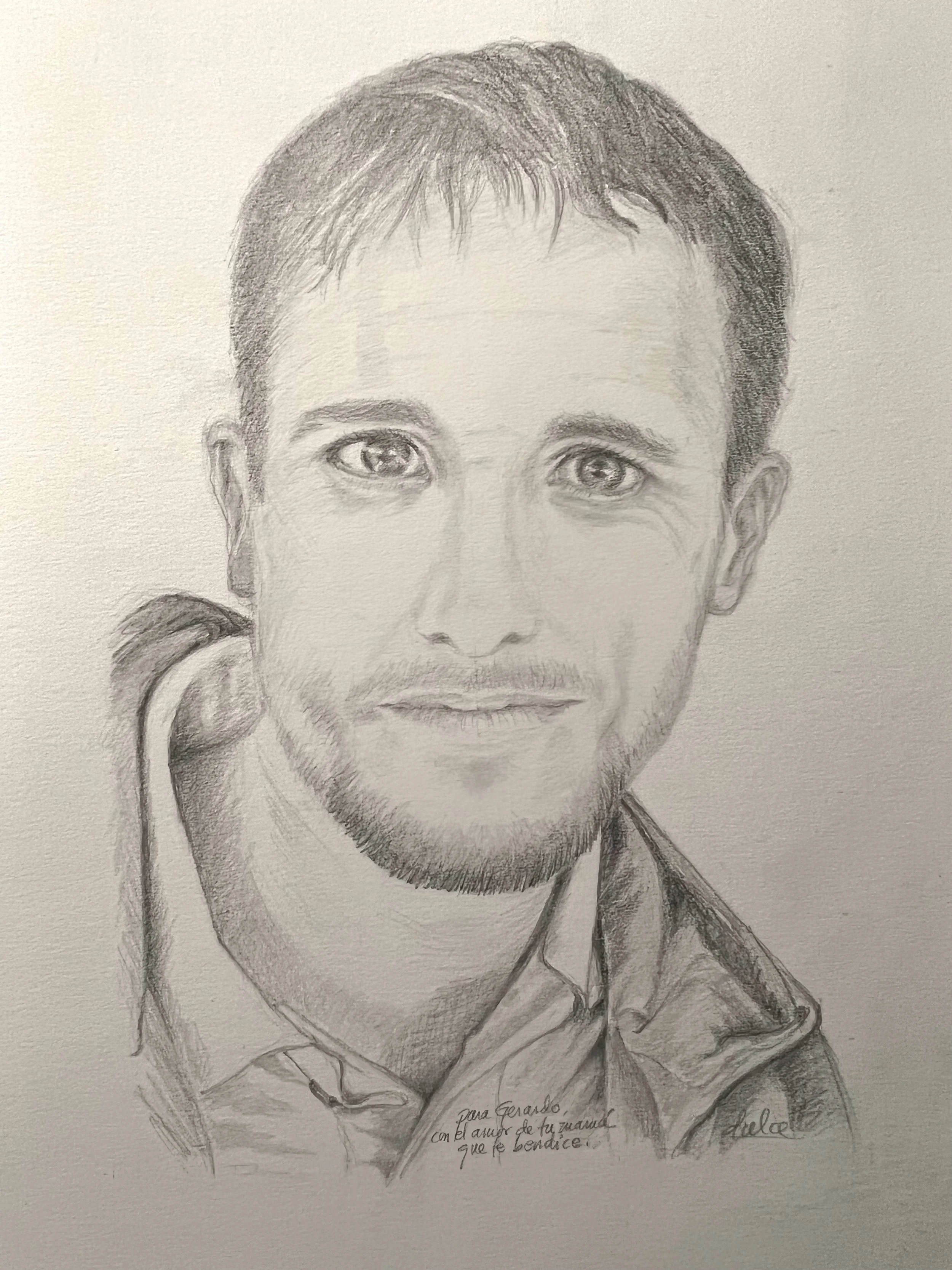 Hand-drawn pencil sketch of a young man with short hair and light beard, wearing a collared shirt, with a small handwritten note at the bottom.