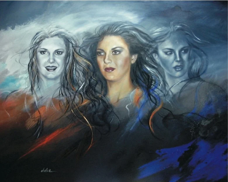 A painted mural of three women's faces with flowing hair, featuring expressive facial features in a mix of realistic and abstract art style.