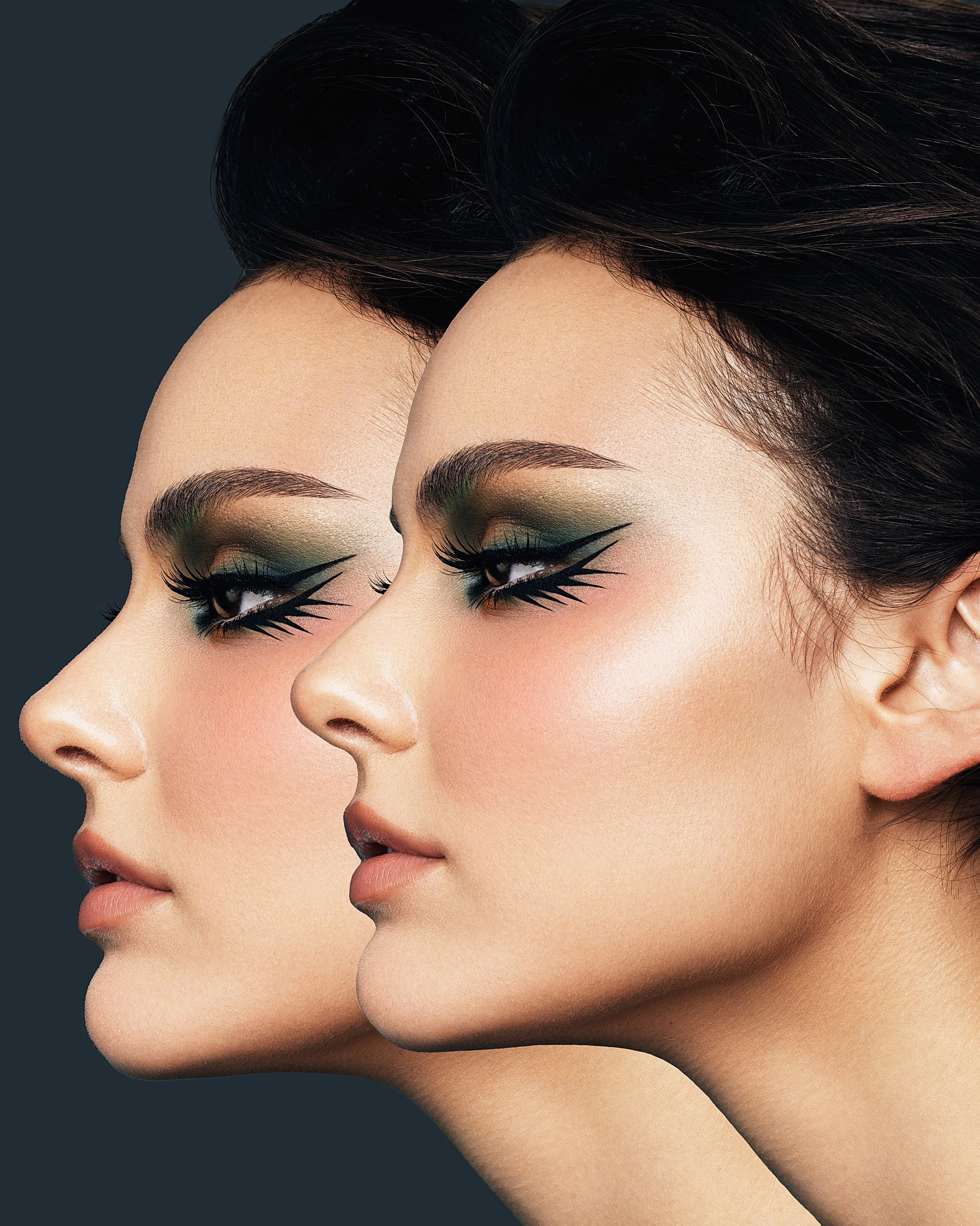 Close-up of two women's profiles with dramatic eye makeup, styled in a fashion shoot format. Beauty Photographer Los Angeles.