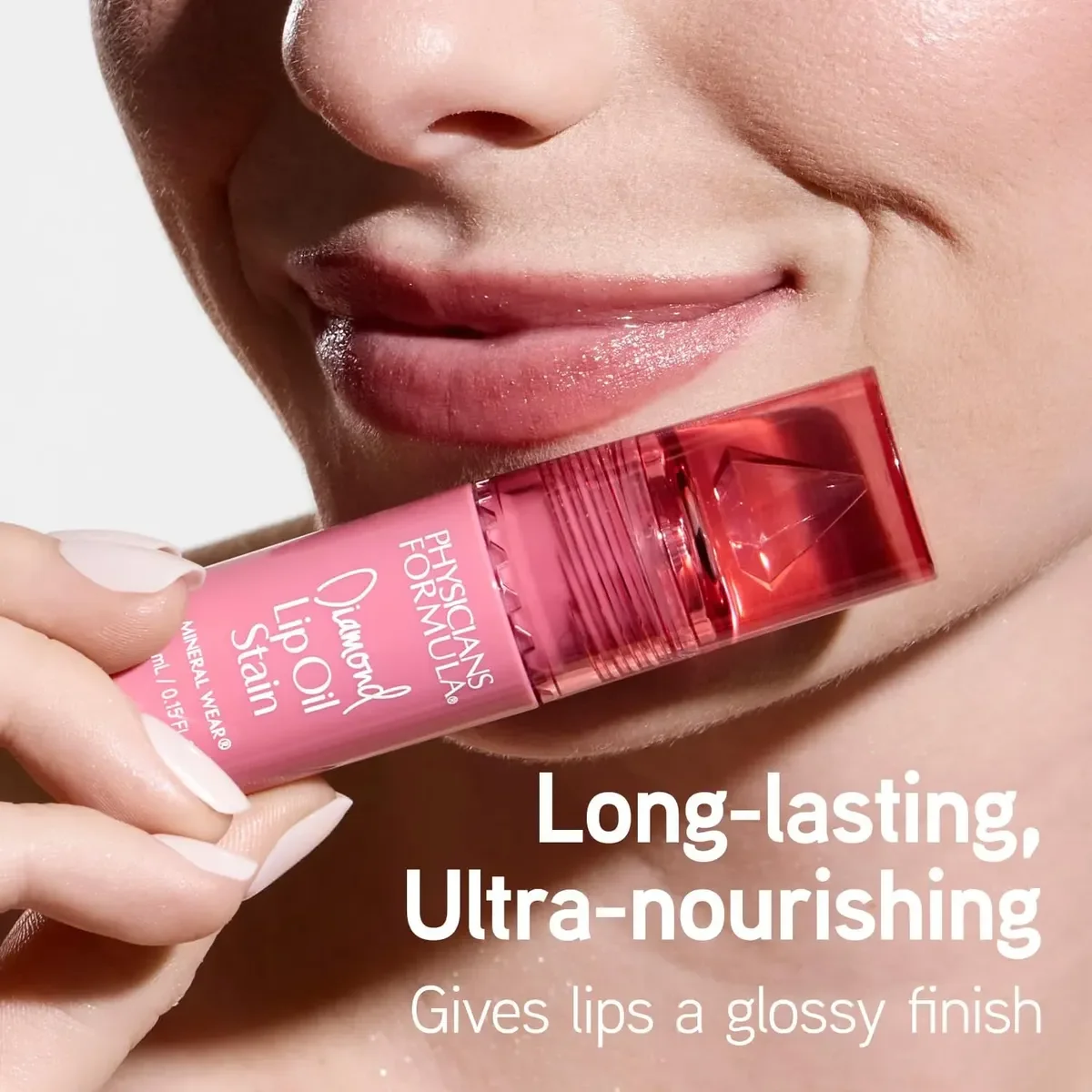 Close-up of a woman's lips with glossy pink lipstick, holding a pink tube of lip oil near her lips. The text on the image reads 'Long-lasting, Ultra-nourishing. Gives lips a glossy finish.'