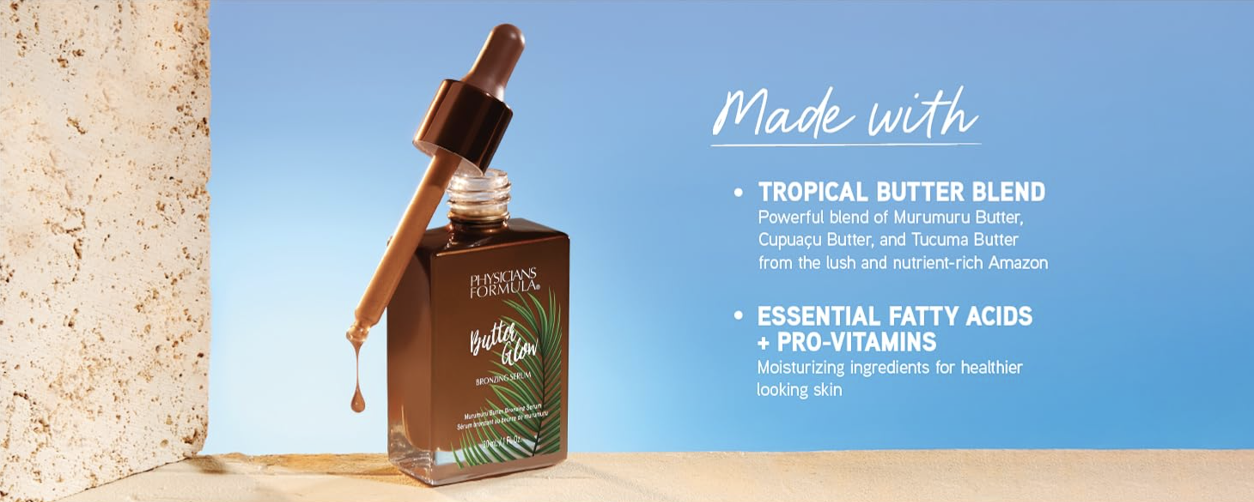 A skincare serum bottle with a dropper, labeled 'Physicians Formula BB Glow' with a tropical leaf design, positioned on a sandy surface against a blue sky background, with text describing its key ingredients: tropical butter blend and essential fatty