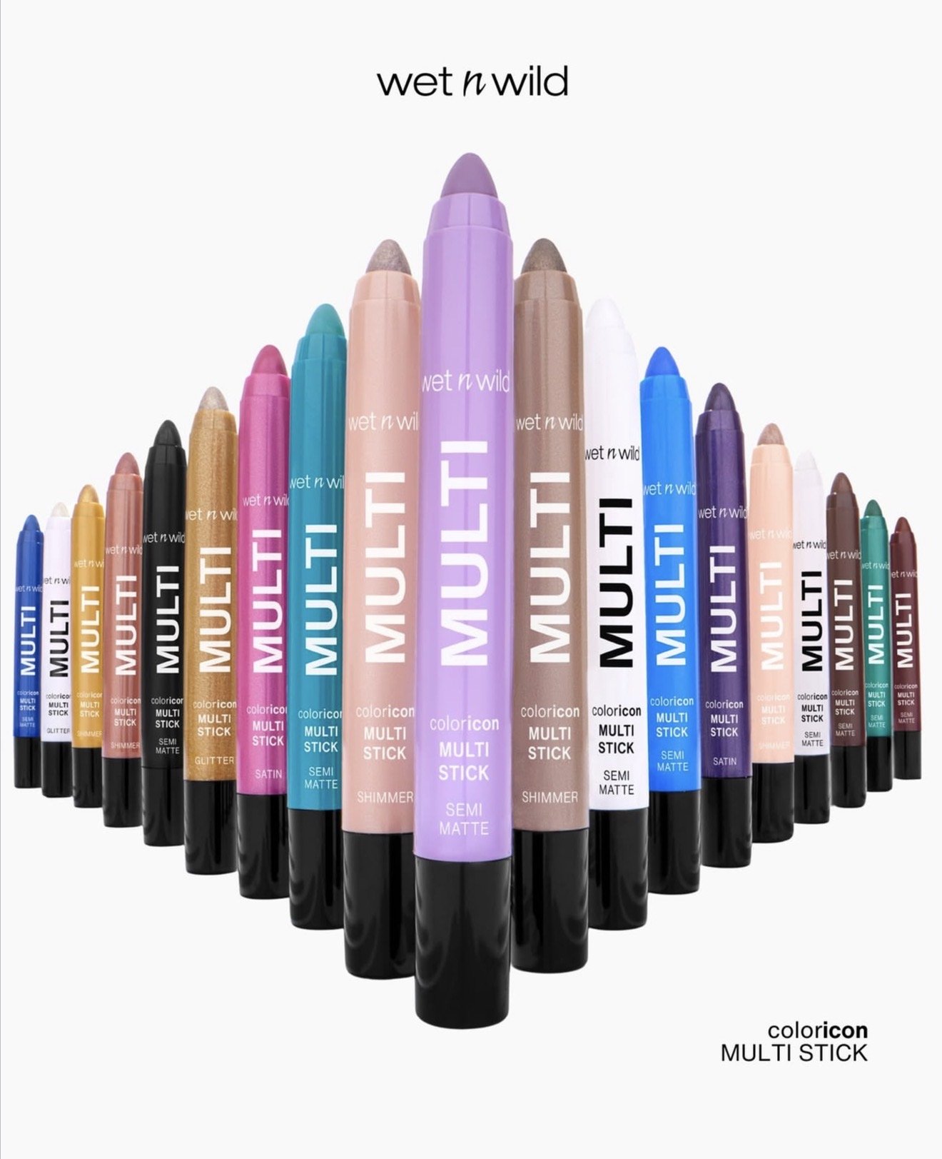 Multiple colorful Wet n Wild Coloricon Multi Stick makeup products arranged in a semi-circle, with a white background and the brand name at the top. Product photography Los Angeles.