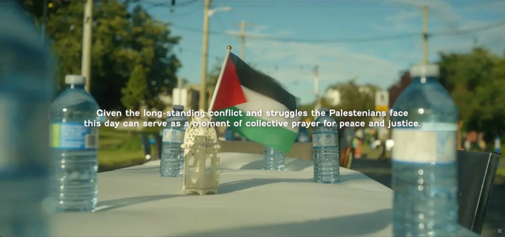 A table set with water, a lantern and a Palestinian flag at the Day of Arafah gathering in Victoria