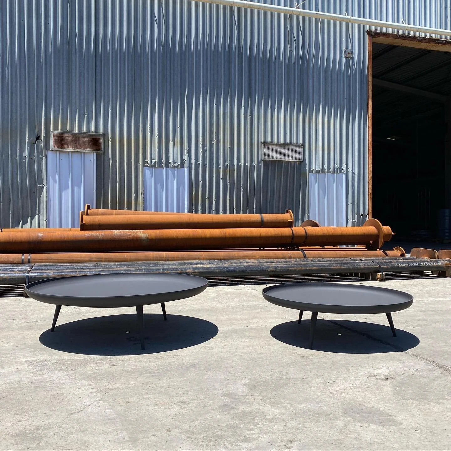 Our custom fire pits are made from 6mm pressed and rolled steel. Small and large size pictured here. Custom designs available.