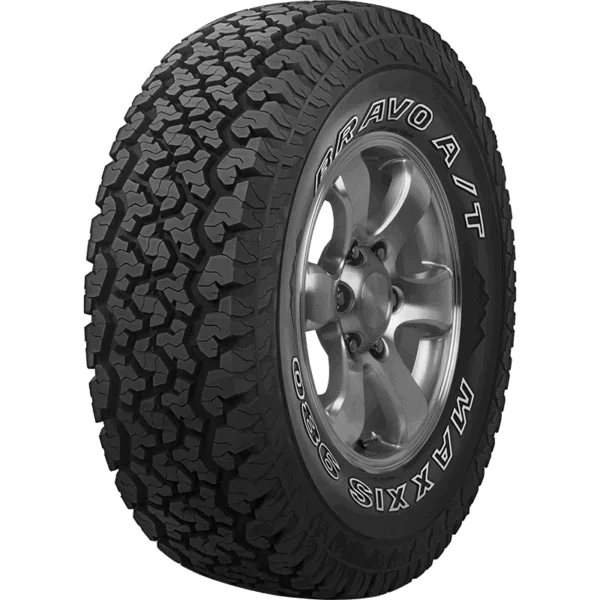 Close-up of a Maxxis Bravo A/T all-terrain tire mounted on a metallic alloy wheel.