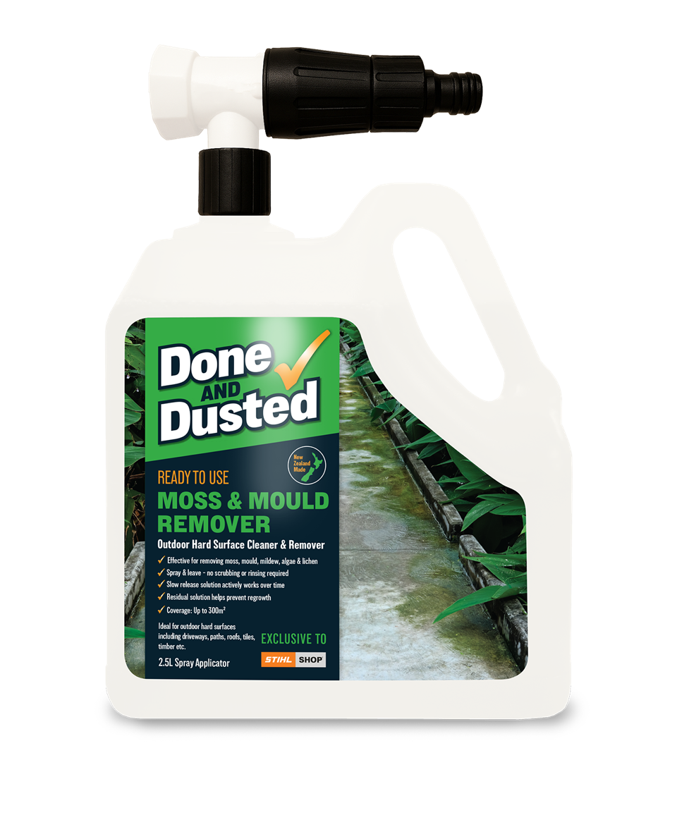 A white plastic bottle of Done and Dusted Moss and Mould Remover with a black spray nozzle, placed over a background image of a moss-covered outdoor pathway between green plants.