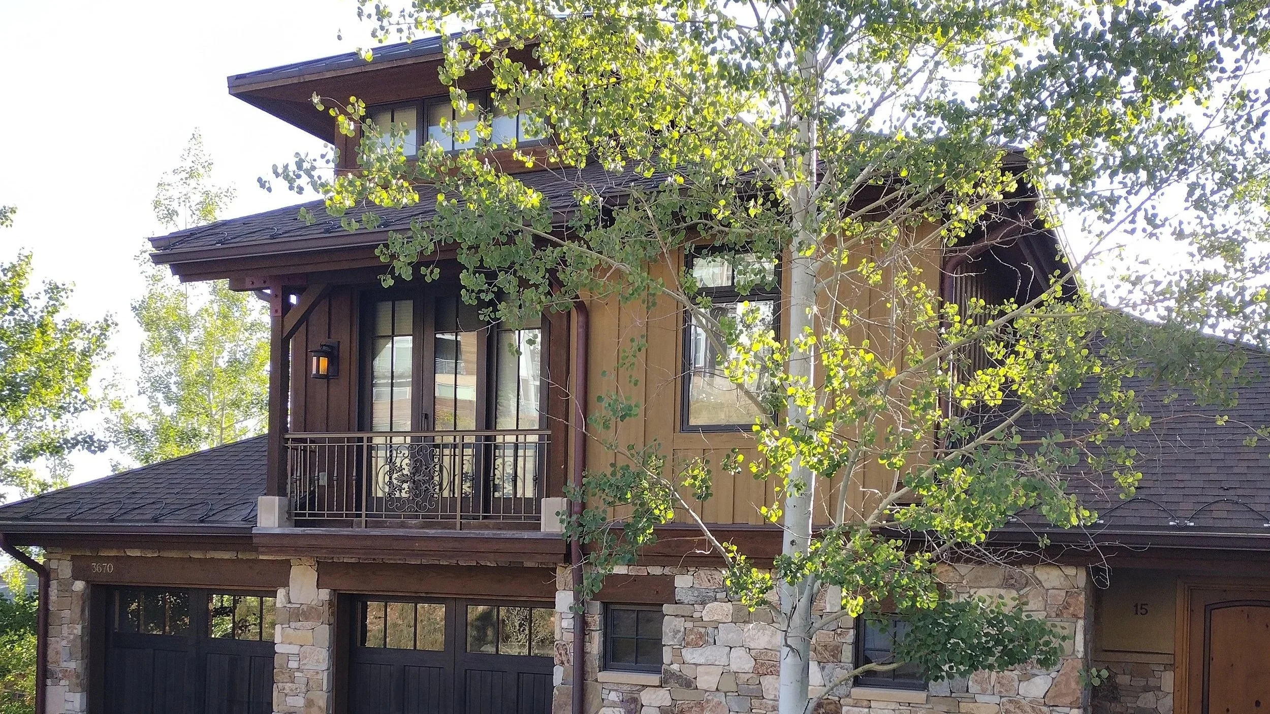 Recently completed exterior painting project in Park City, Utah featuring a freshly painted home with clean siding, updated trim, and a modern finish.