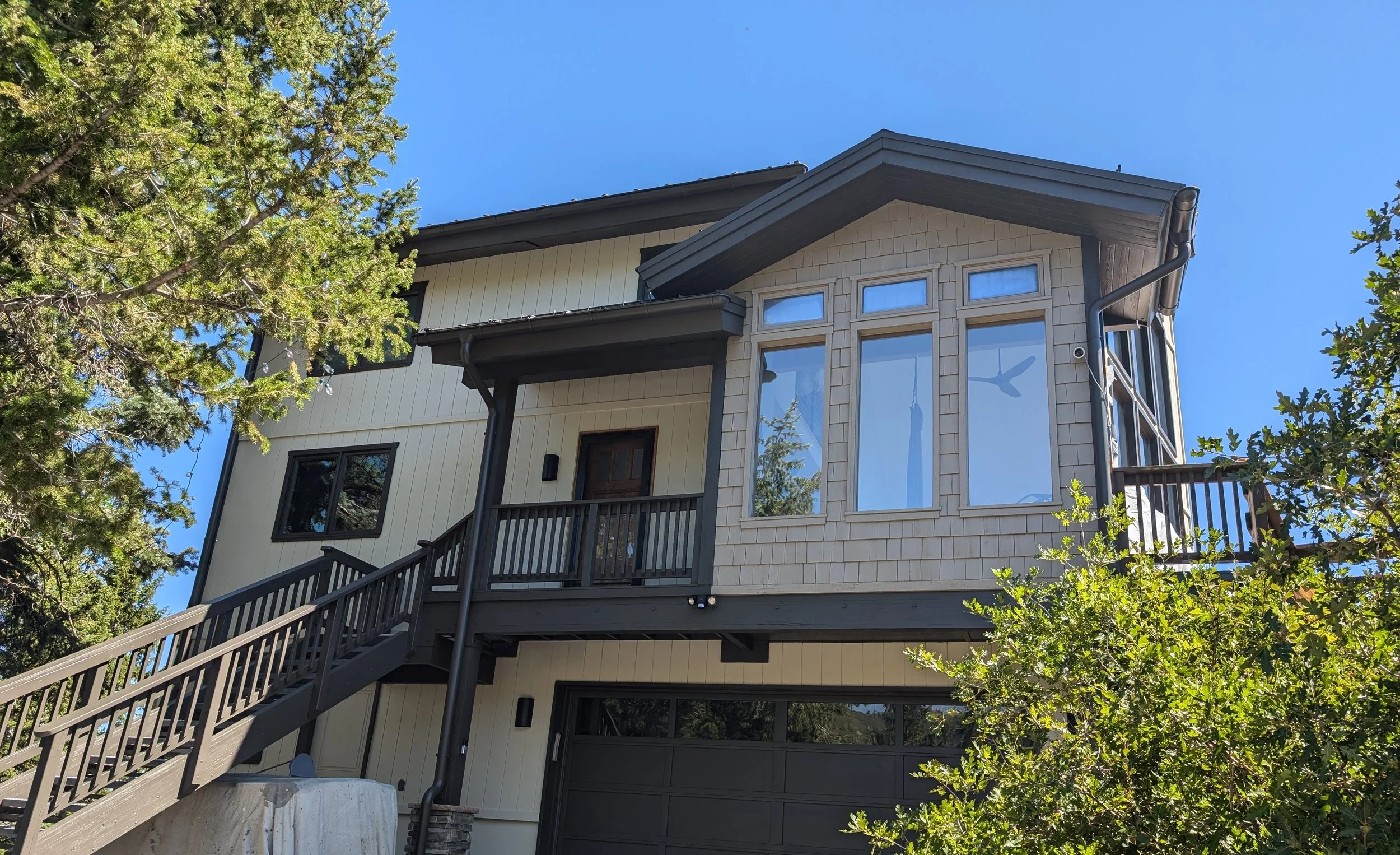 Exterior painting project on a residential home in Park City, Utah with newly finished siding and trim.