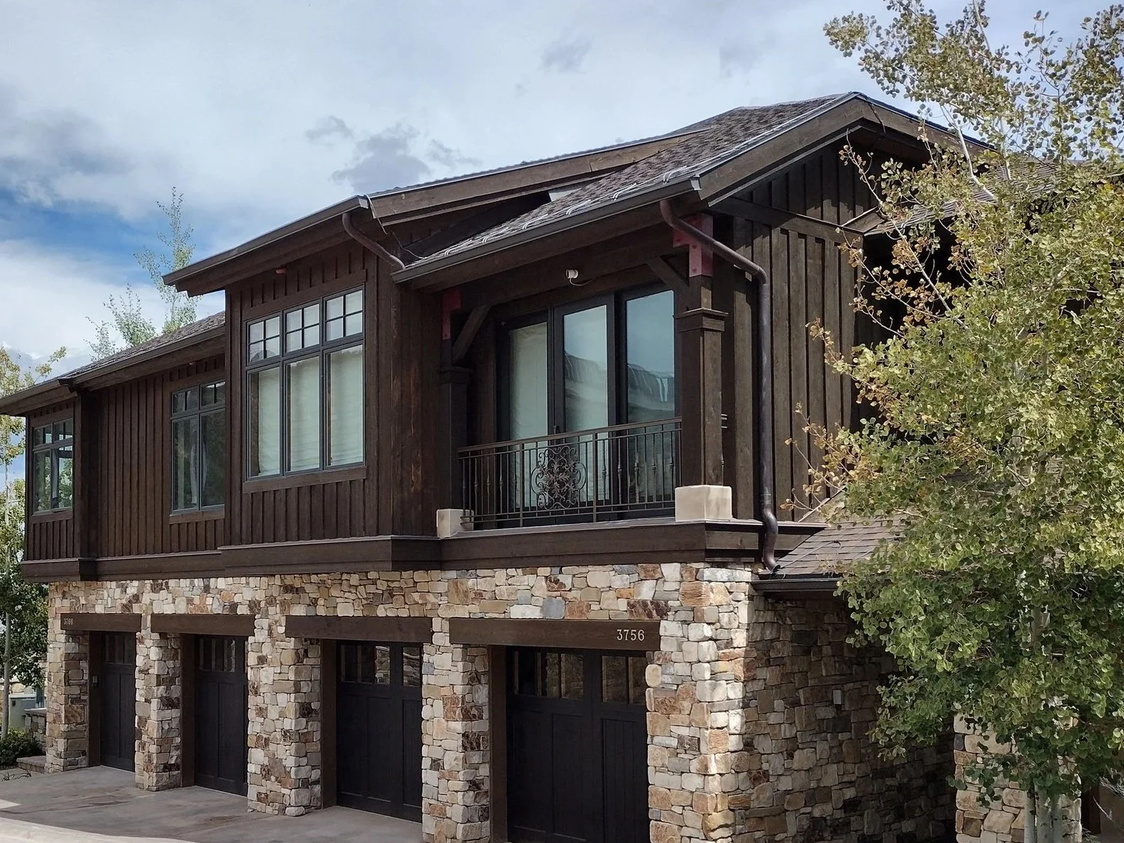 Park City Utah commercial painting project featuring townhome exteriors with peeling paint and sun-faded wood siding ready for professional repainting and staining.